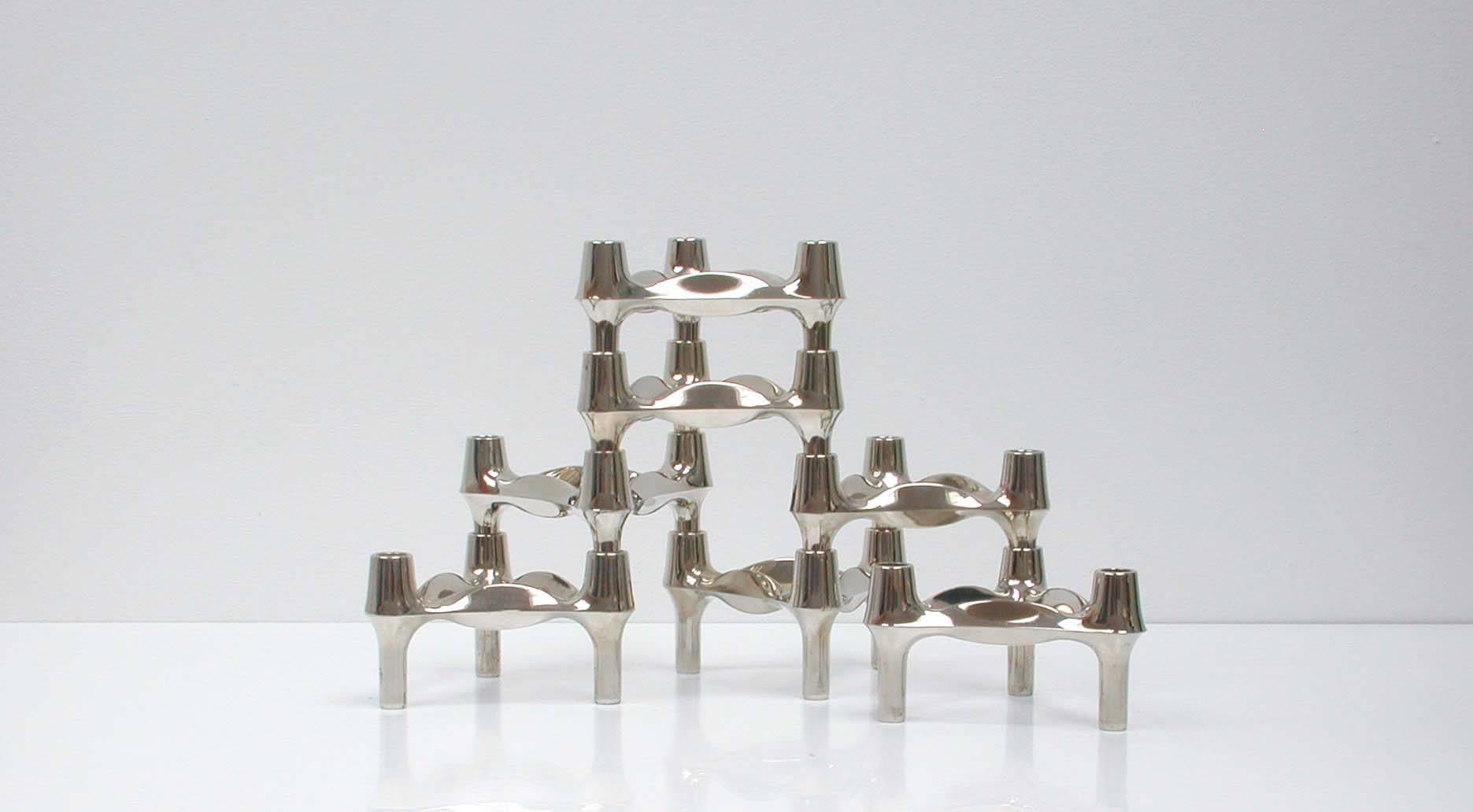 Unusual set of seven midcentury modular triangle shaped chrome candle holders by BMF. Made in Germany in the 1960s. The candleholders can be stacked in whichever design you wish with as many candles you would like.

Design by Caesar