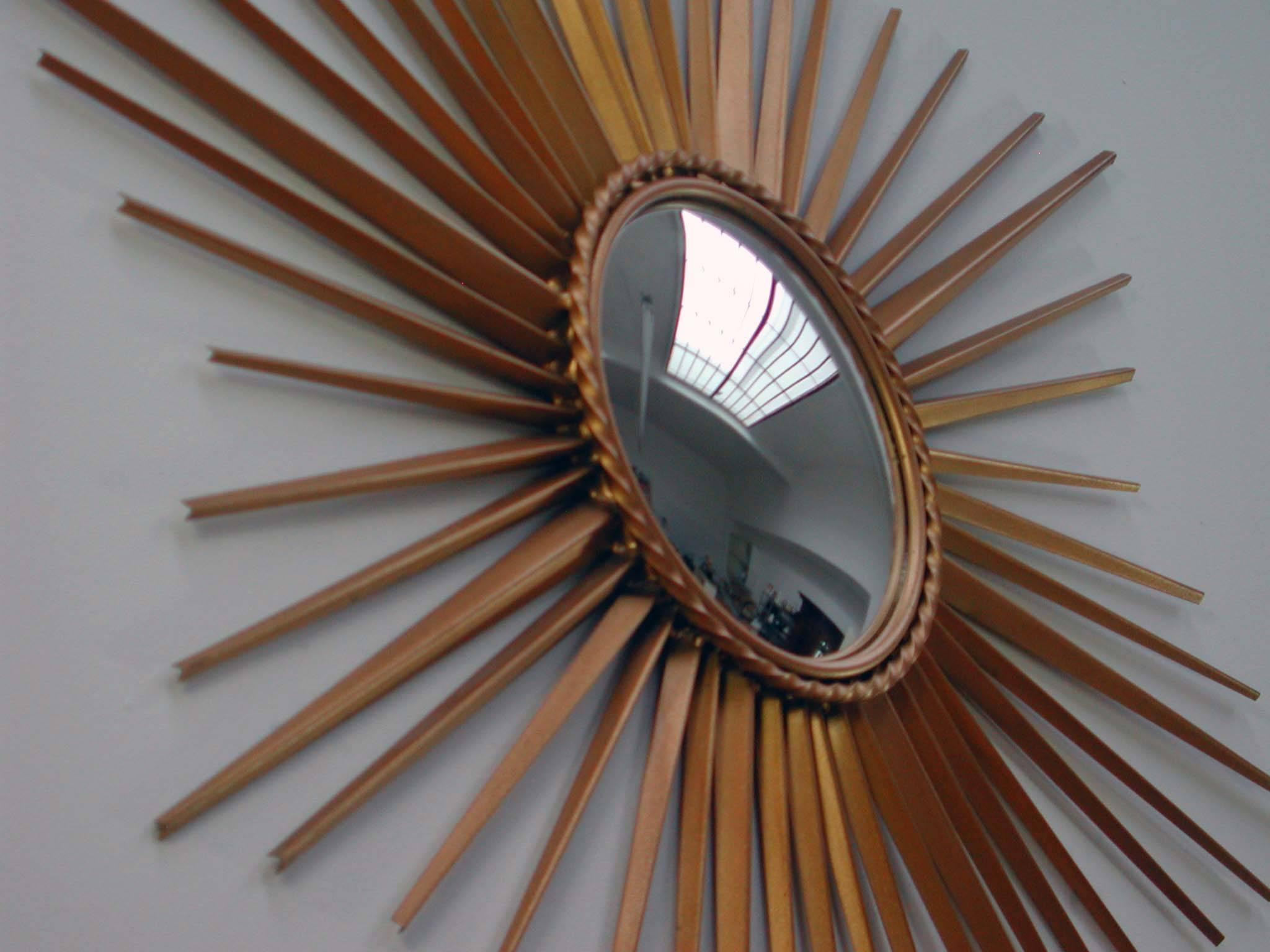 Mid-Century Modern French Chaty Vallauris sunburst starburst gilt wall mirror with convex mirror glass.
Measure: Total diameter 30.75