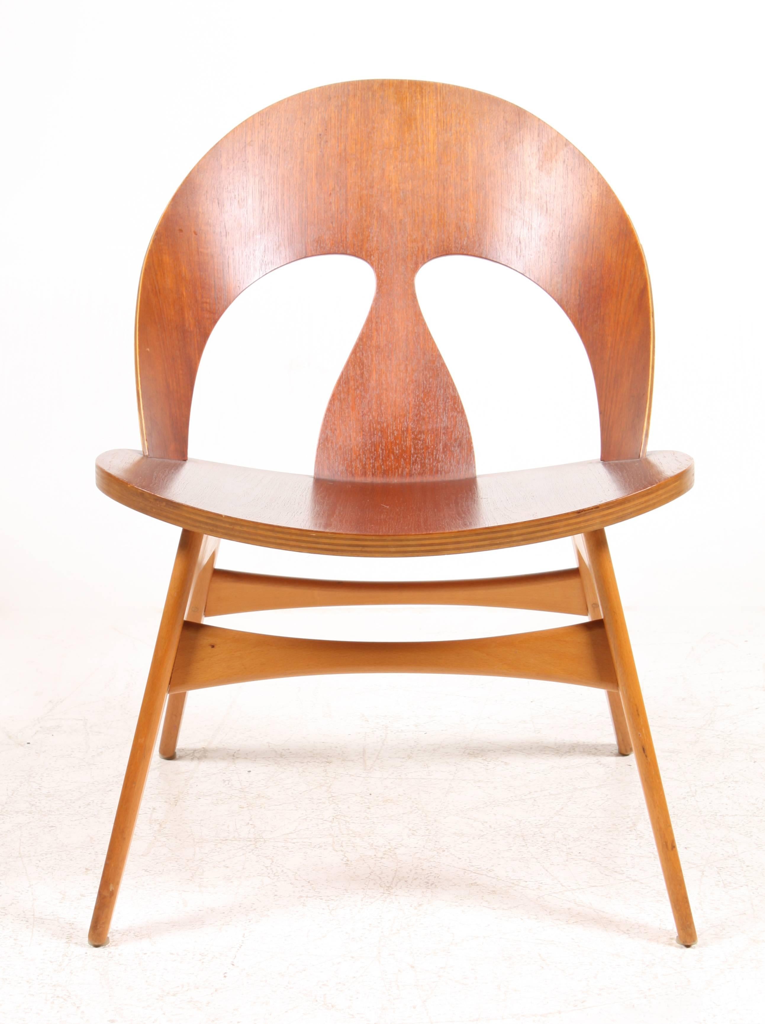 Pair of rare lounge chairs in teak plywood and beech, designed by MAA Børge Mogensen, made by Erhard Rasmussen cabinetmakers in 1950. Great original condition.