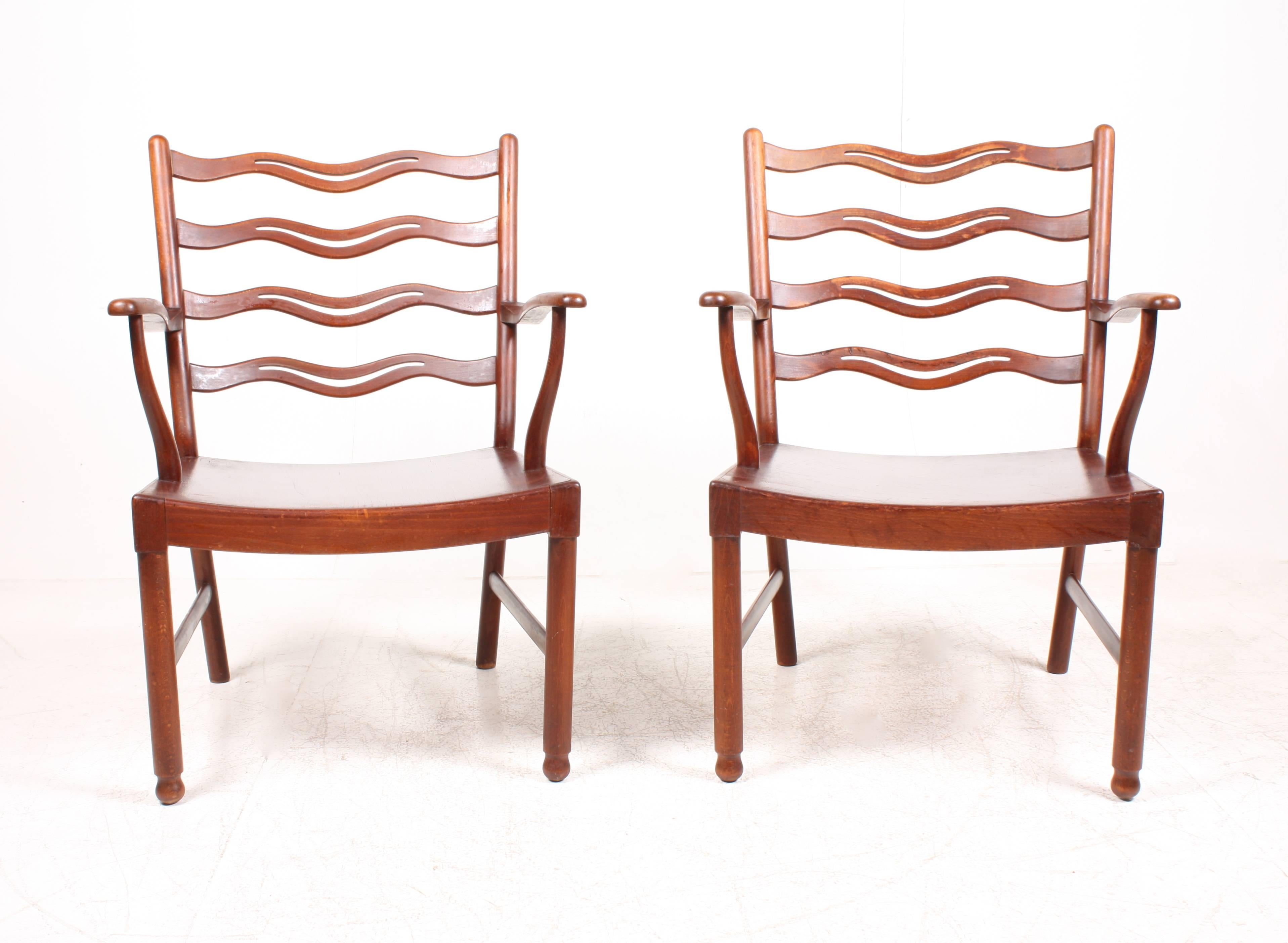 Stained Pair of Ladder Back Lounge Chairs by Ole Wanscher
