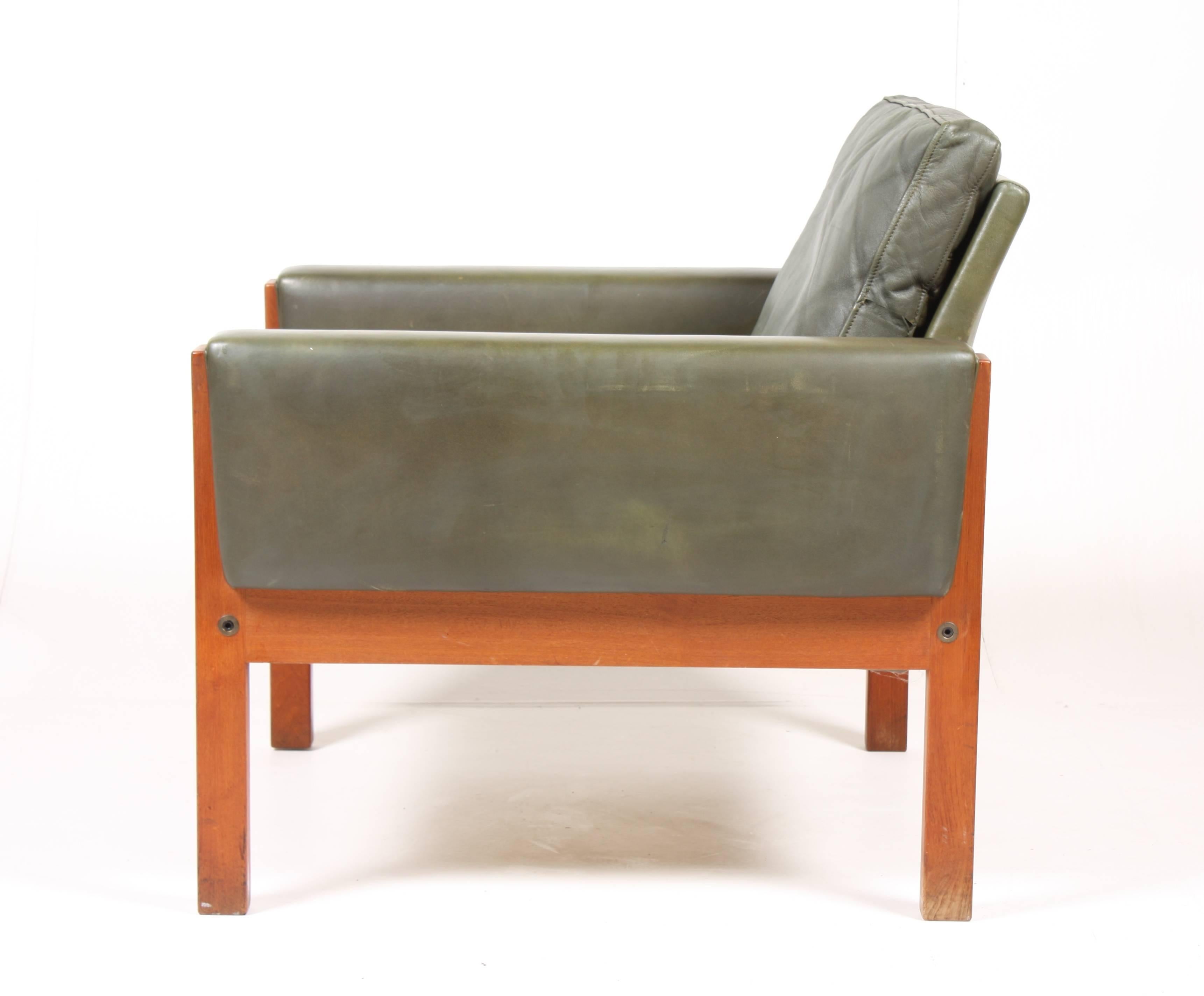 Pair of very comfortable lounge chairs in patinated green leather and teak designed by Maa. Hans J Wegner for AP Stolen ( Anker Petersen ) in 1960. 
Very nice original condition.