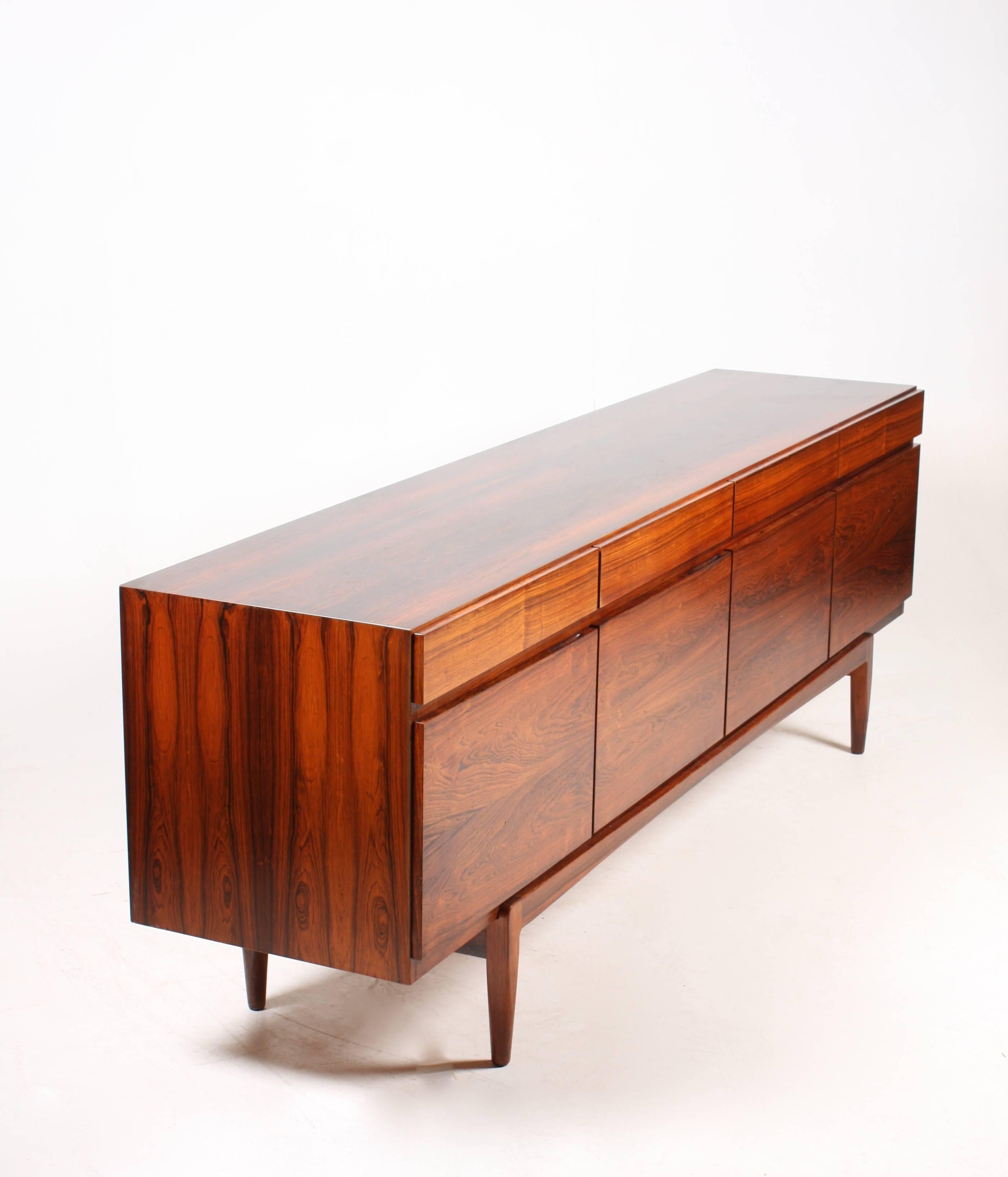 Great looking sideboard in rosewood designed by MAA. Ib Kofod-Larsen. Made by Faarup Møbelfabrik. Model no.66. Original condition.