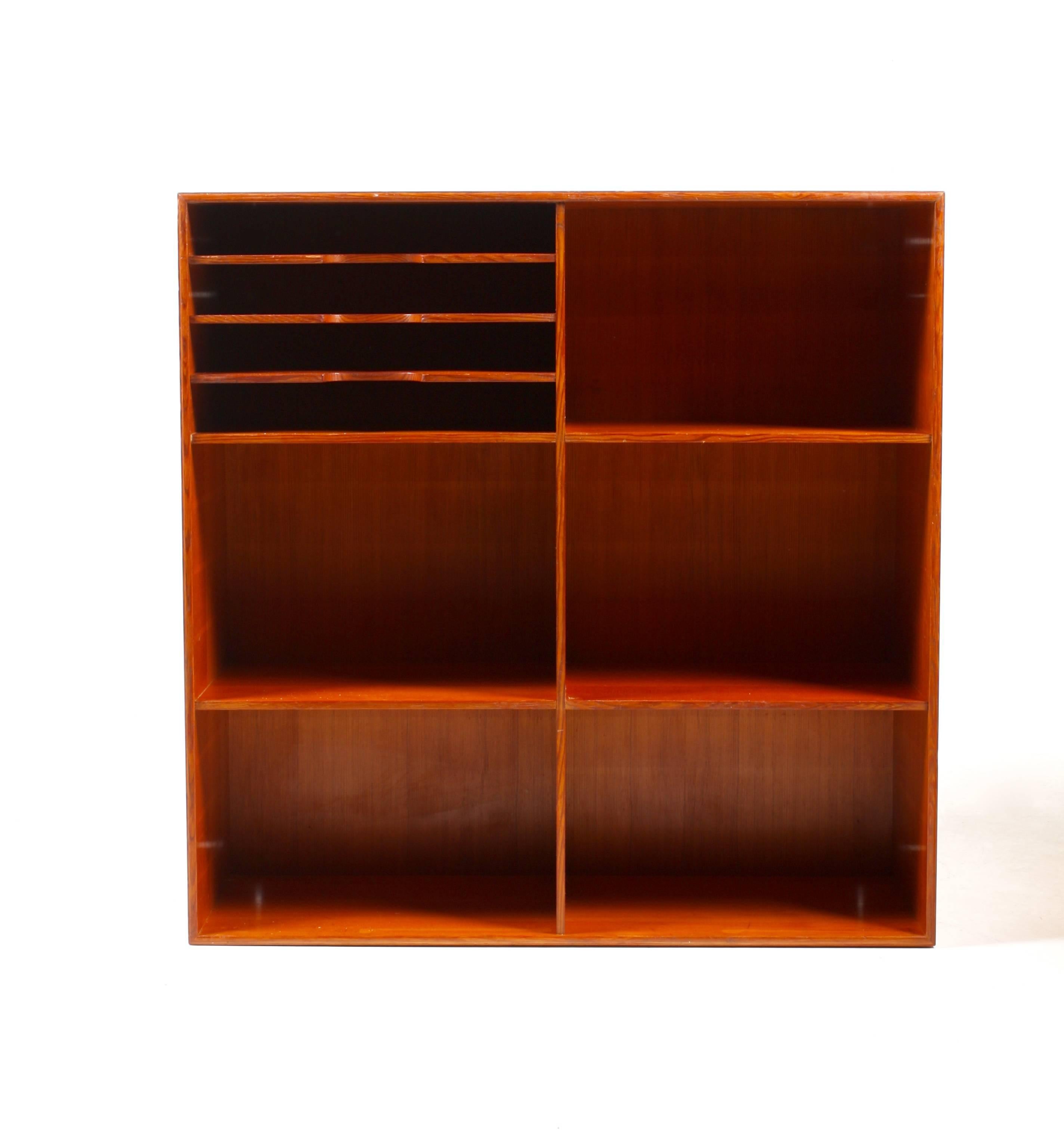 Bookcase in Oregon pine designed by Mogens Koch for Rud. Rasmussen cabinetmakers in 1933. Made in Denmark and in all original condition.