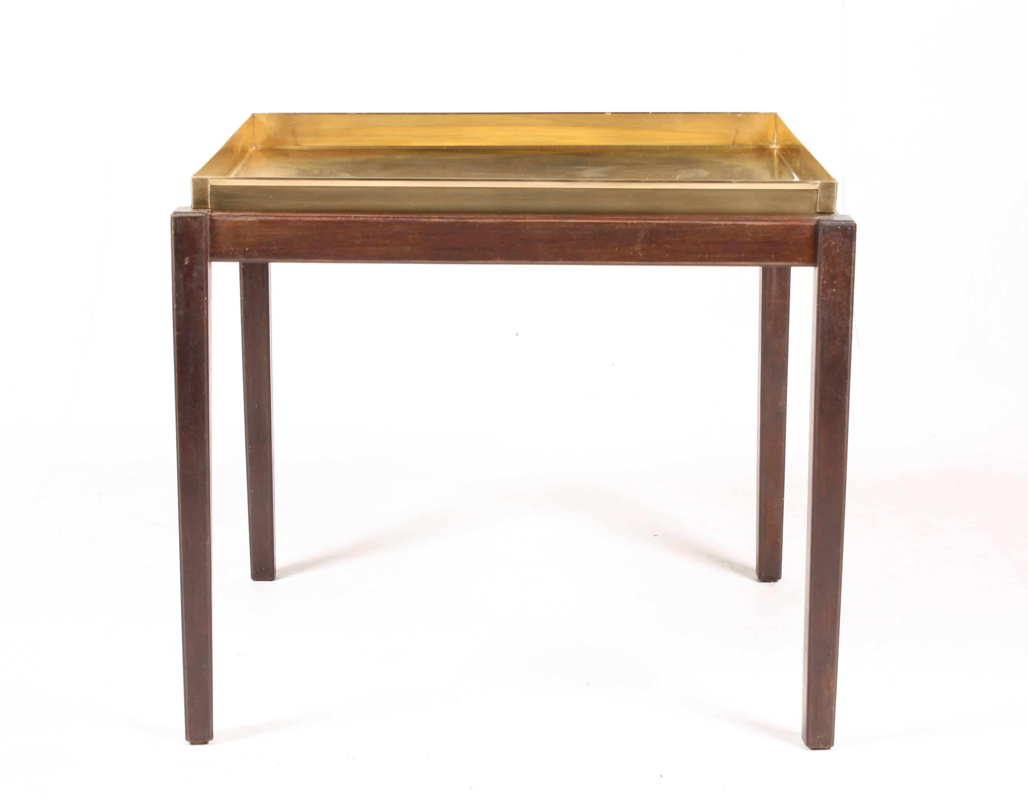 Side table in mahogany and brass. Made in Denmark in the 1960s. Great condition.