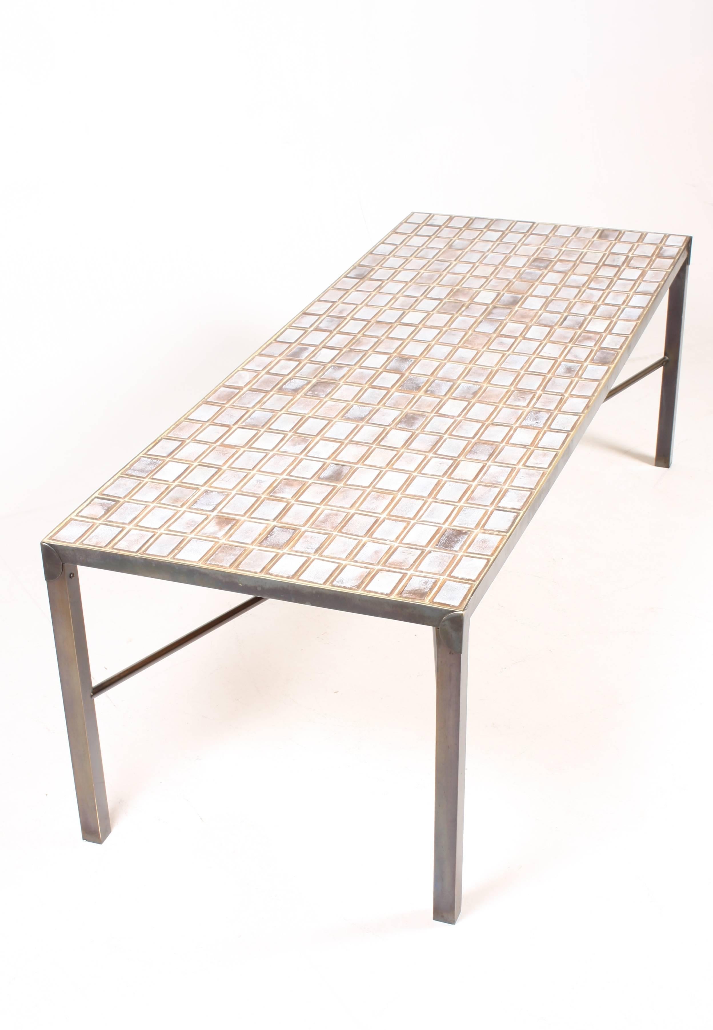 Low table, handmade ceramic tiles on an brass base. Made in Denmark in the 1970s. Great condition.