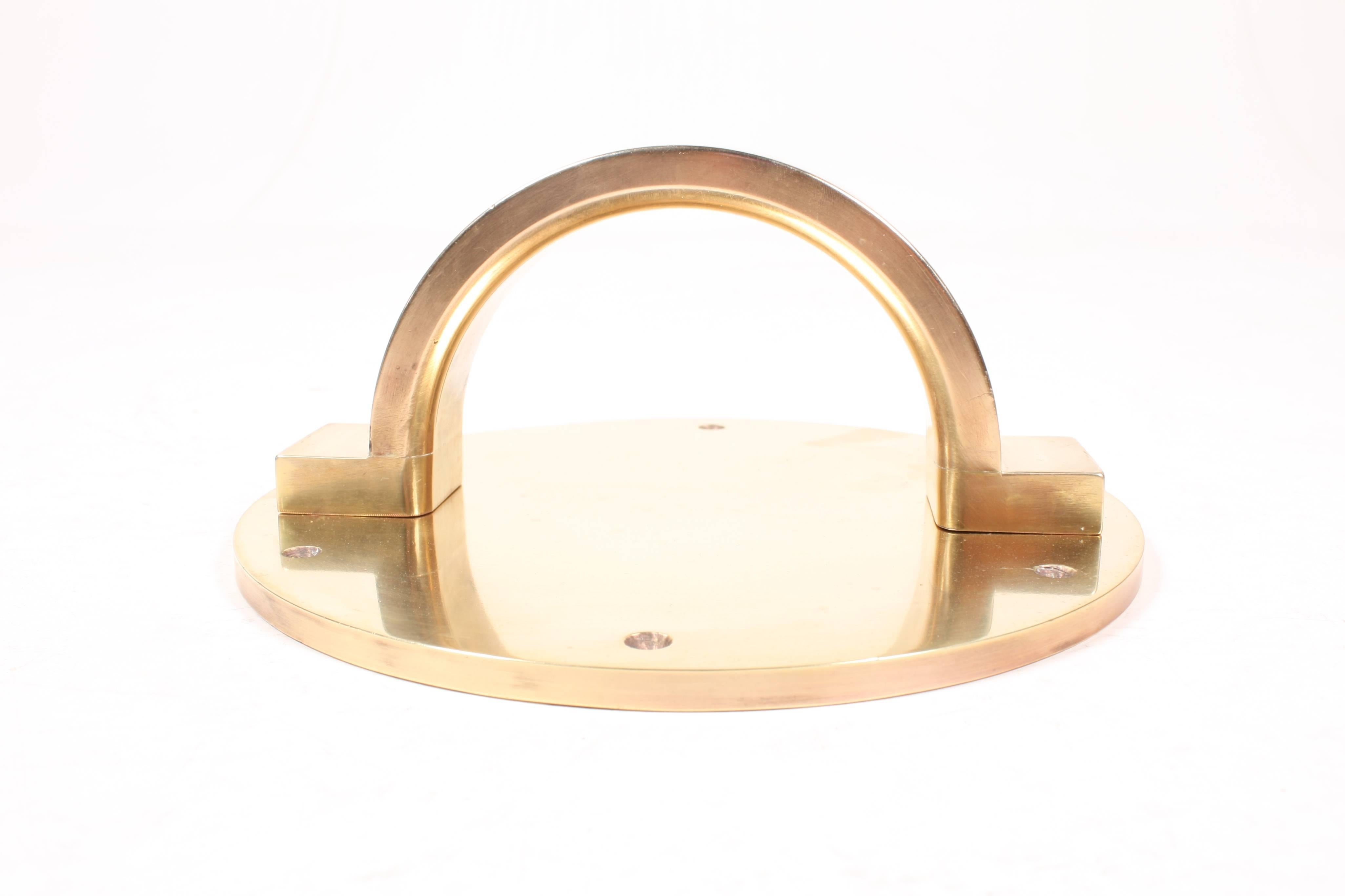 Art Deco front door pull in solid brass, made in Denmark in the 1930s
14 pieces available.