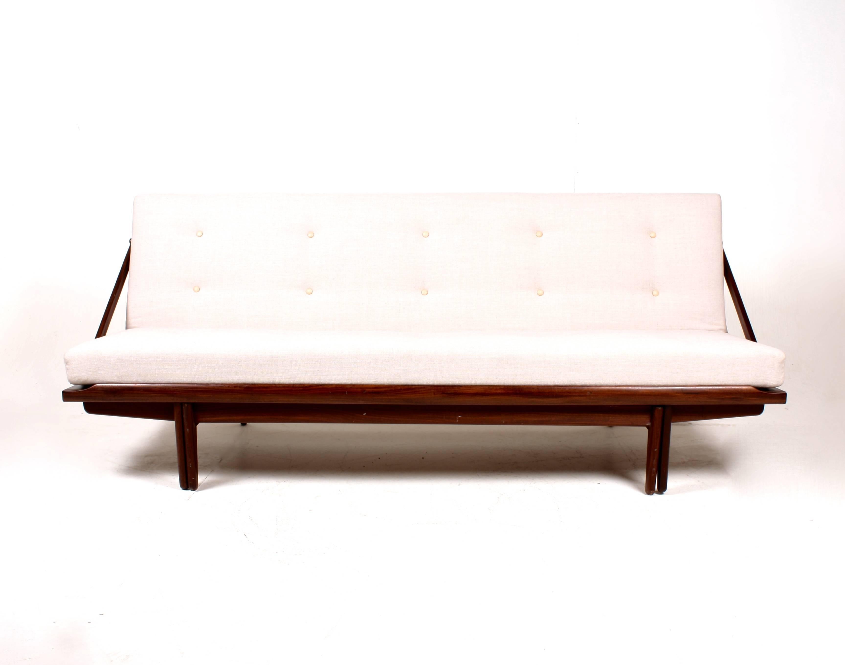 Poul Volther daybed. Seat and flip back upholstered in light new wool with leather buttons. Frame in solid teak. Manufactured by Frem Røjle, Denmark in the 1950s. Great condition.