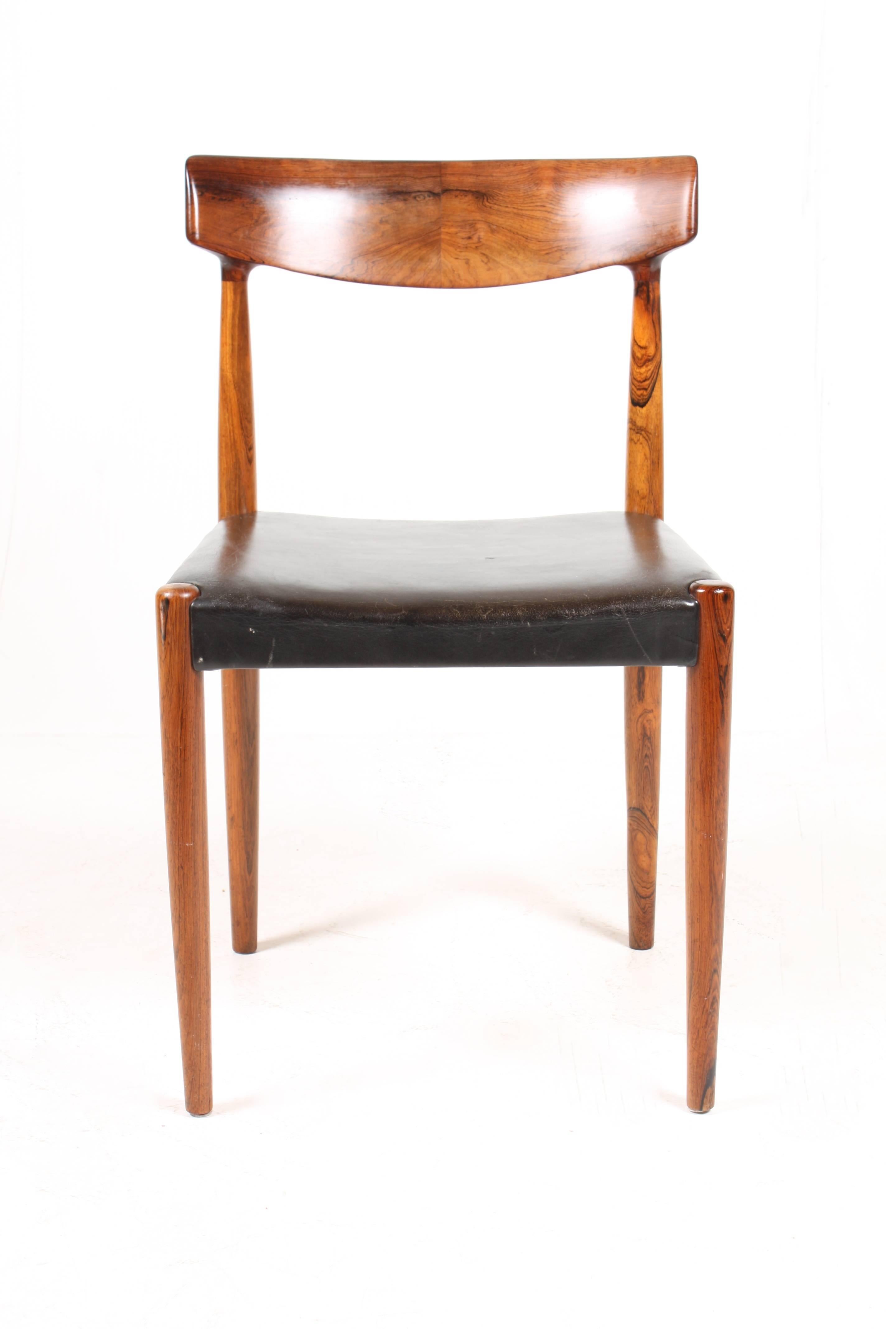 Set of six dining chairs in solid rosewood with seats in patinated black leather. Designed by Knud Færch. Model no. 343. Made by Slagelse Møbelværk A/S of Denmark. Great original condition.