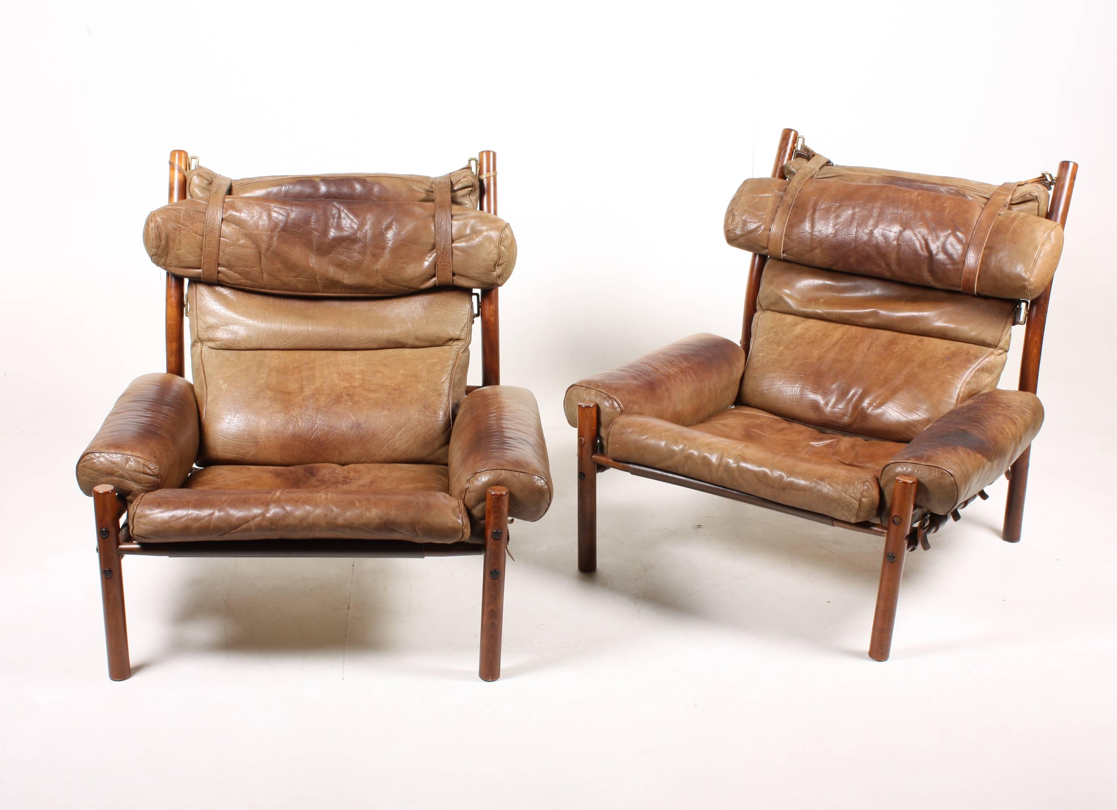 Pair of Inca series lounge chairs in patinated leather designed by Arne Norell in 1968. Made by Norell Möbel AB in Sweden. Great original condition.
