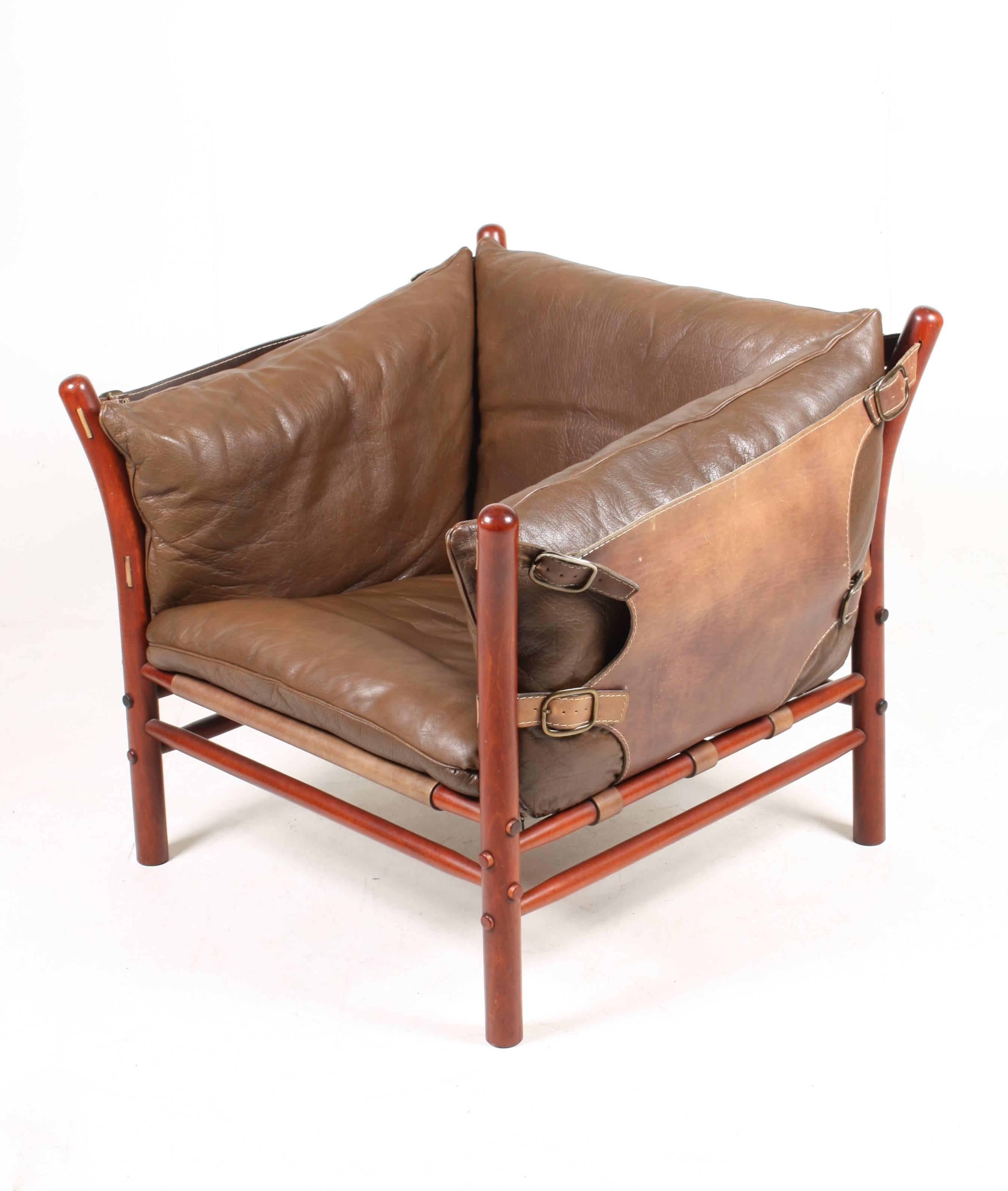 Lounge chair in beautiful patinated leather, wood frame and brass hardware. Model Ilona designed by Swedish architect Arne Norell for Norell Möbel AB in the 1960s.

The chair is cleaned, waxed and is from a non-smoker home. Very nice original