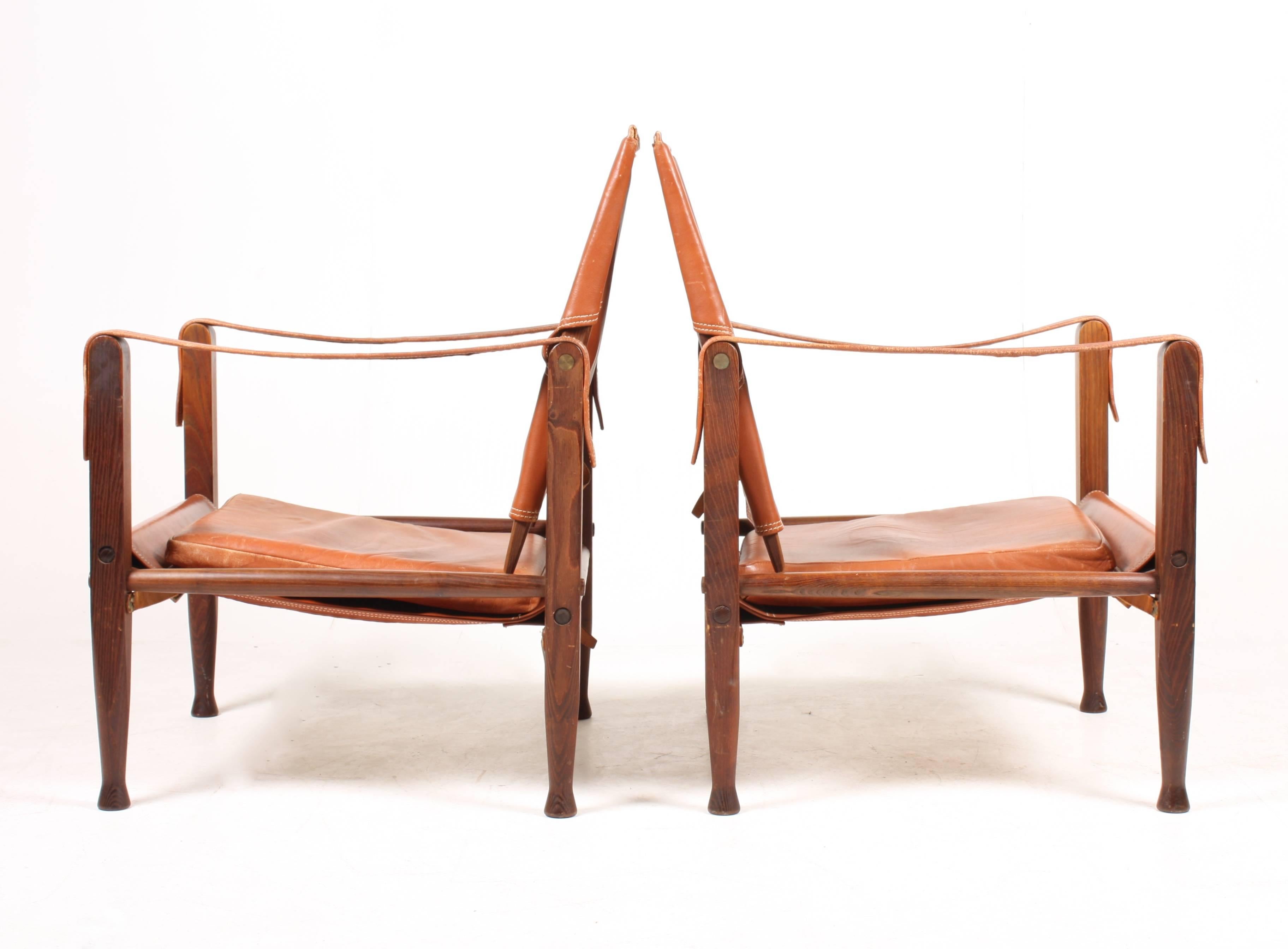 Pair of safari chairs in patinated leather. Designed by Maa. Kaare Klint for Rud Rasmussen cabinetmakers of Denmark in 1933. Great original condition.