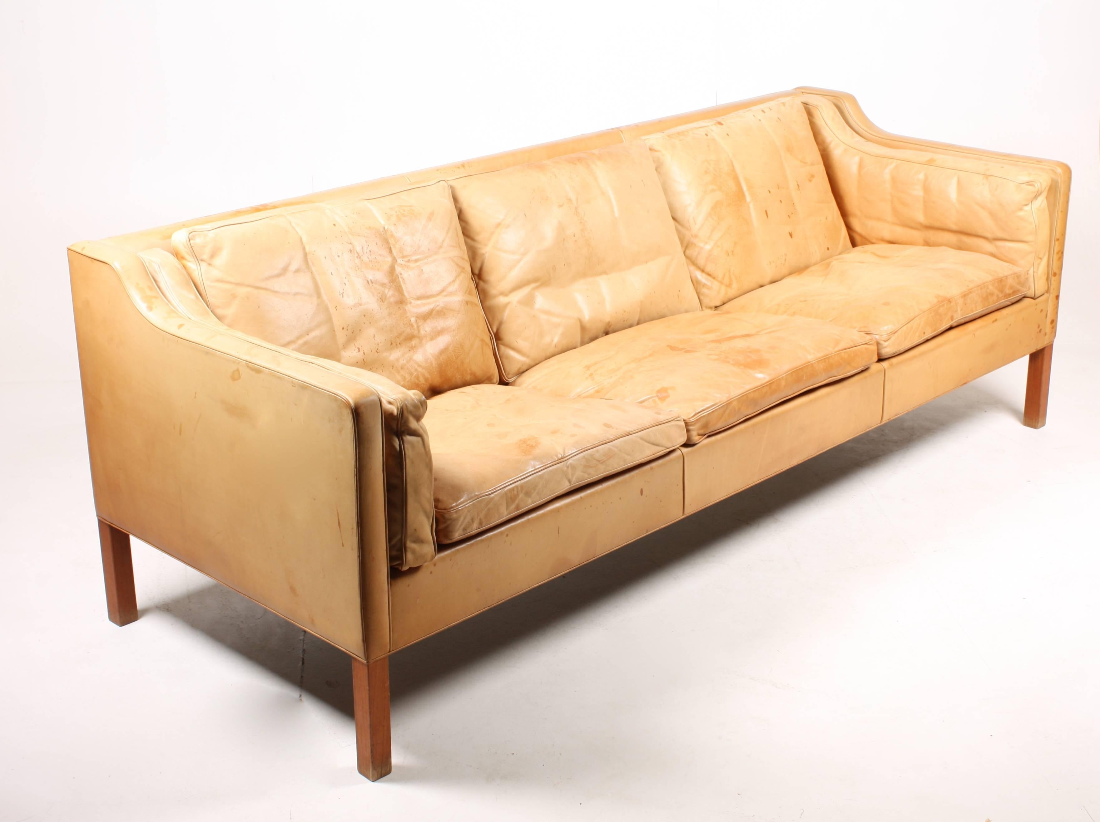 Sofa model 2213 in patinated leather designed by MAA. Børge Mogensen for Fredericia Møbelfabrik in 1962. The sofa was designed as an input for Mogensen’s own home only but is today the most iconic Danish design sofa of all times. Out standing