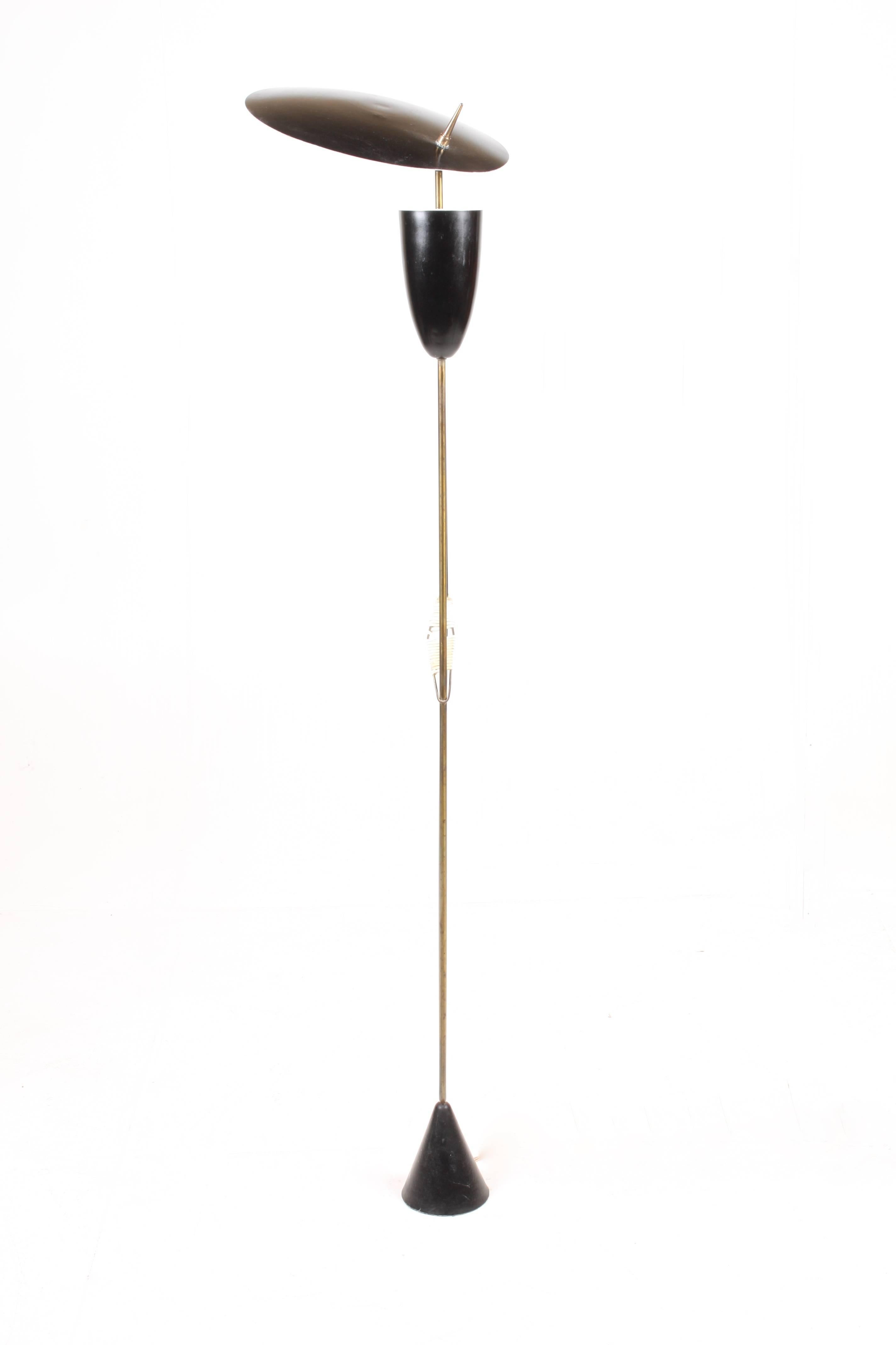 Rare and unique looking floor lamp in brass and black painted metal designed by S.A. Holm sørensen in the 1950´s. Made in Denmark. Great condition.
