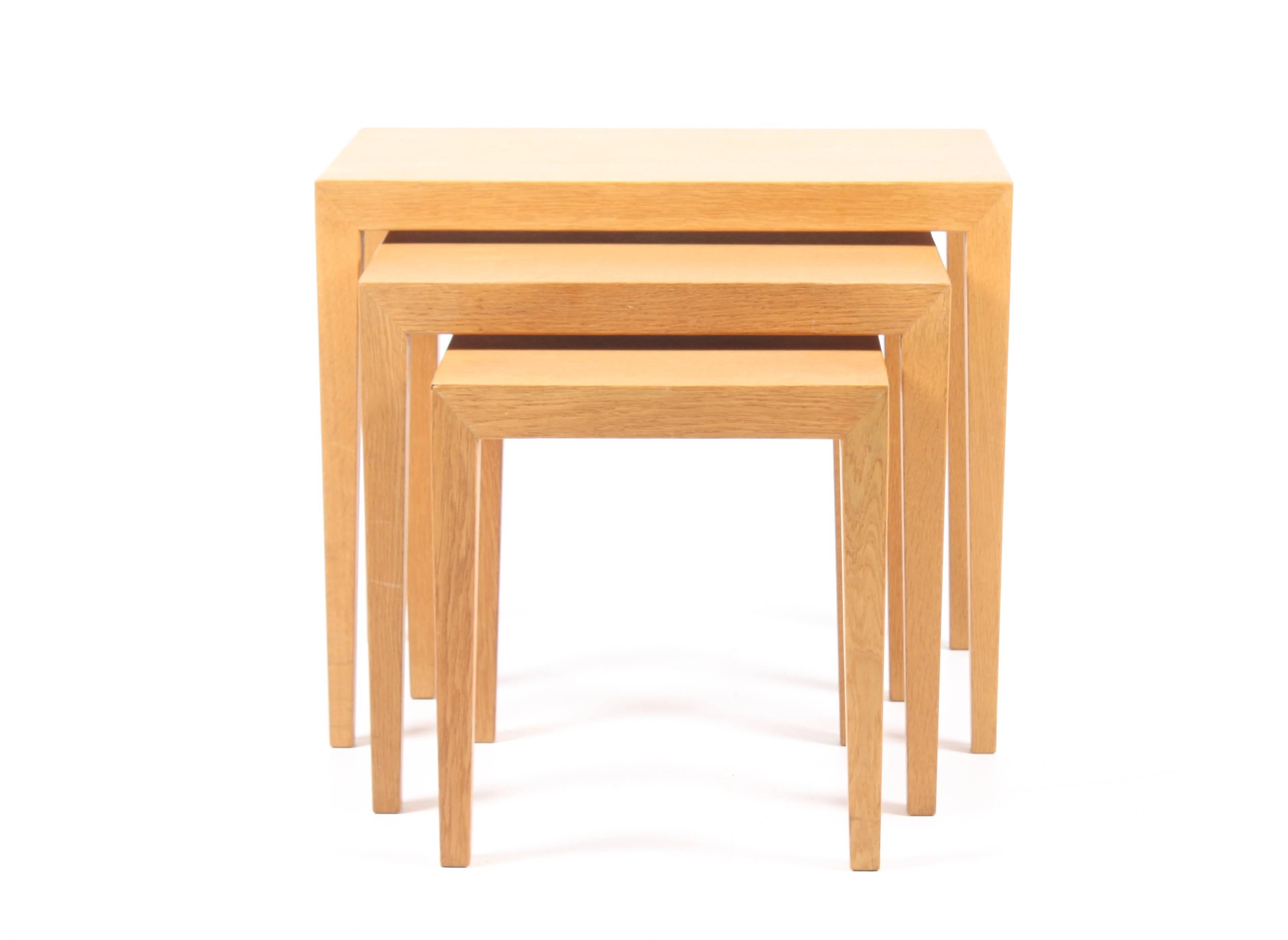 Set of nesting tables in well patinated wax finished Scandinavian oak designed by Maa. Severin Hansen Jr. for Haslev Furniture in 1958. Great condition.