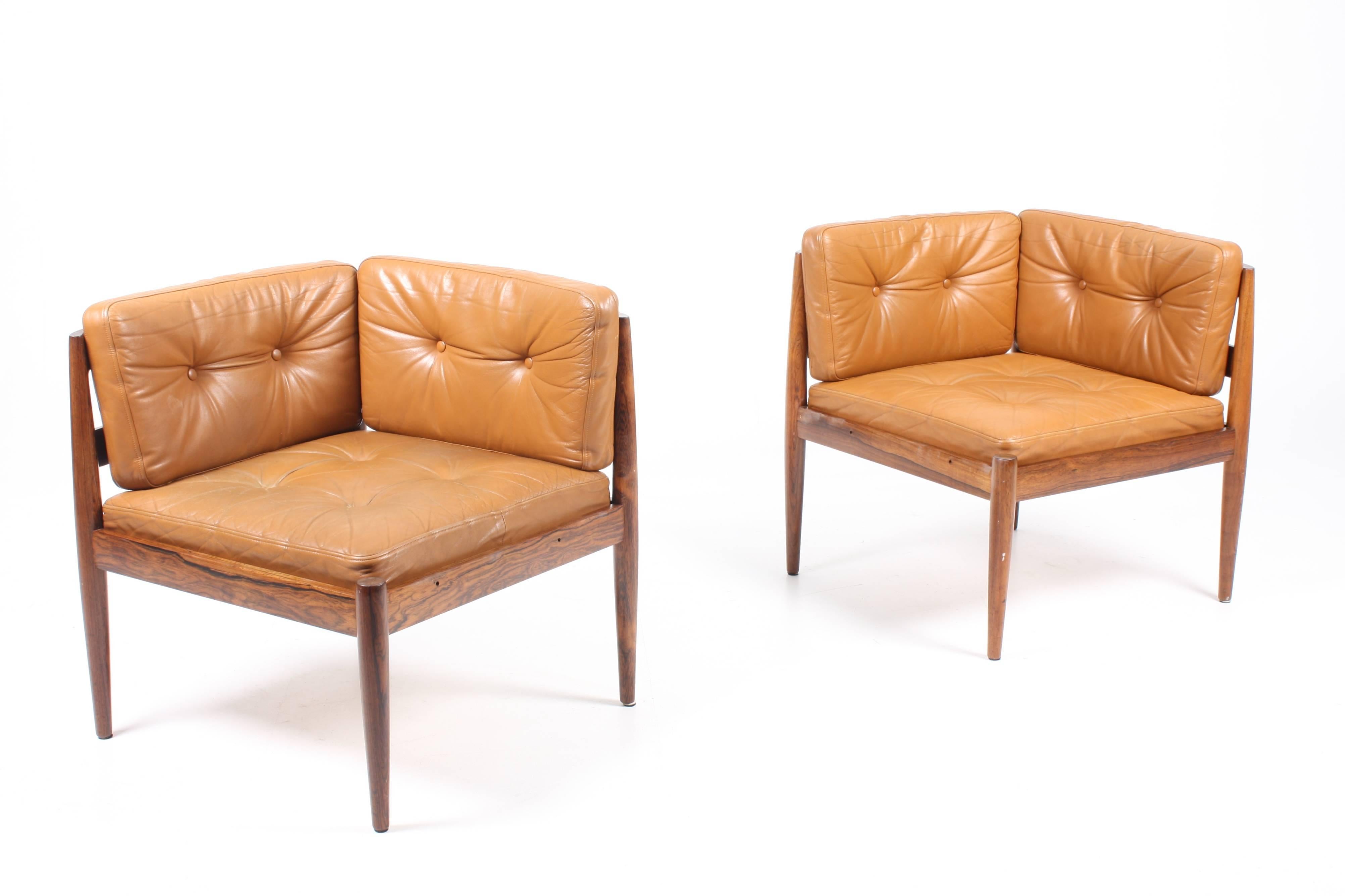 Great looking sofa / easy chairs with ottoman made in solid rosewood with seats and back in patinated leather. Designed by Maa. Kai Kristensen for Magnus Olesen cabinet makers in the 1960s. Great original condition.