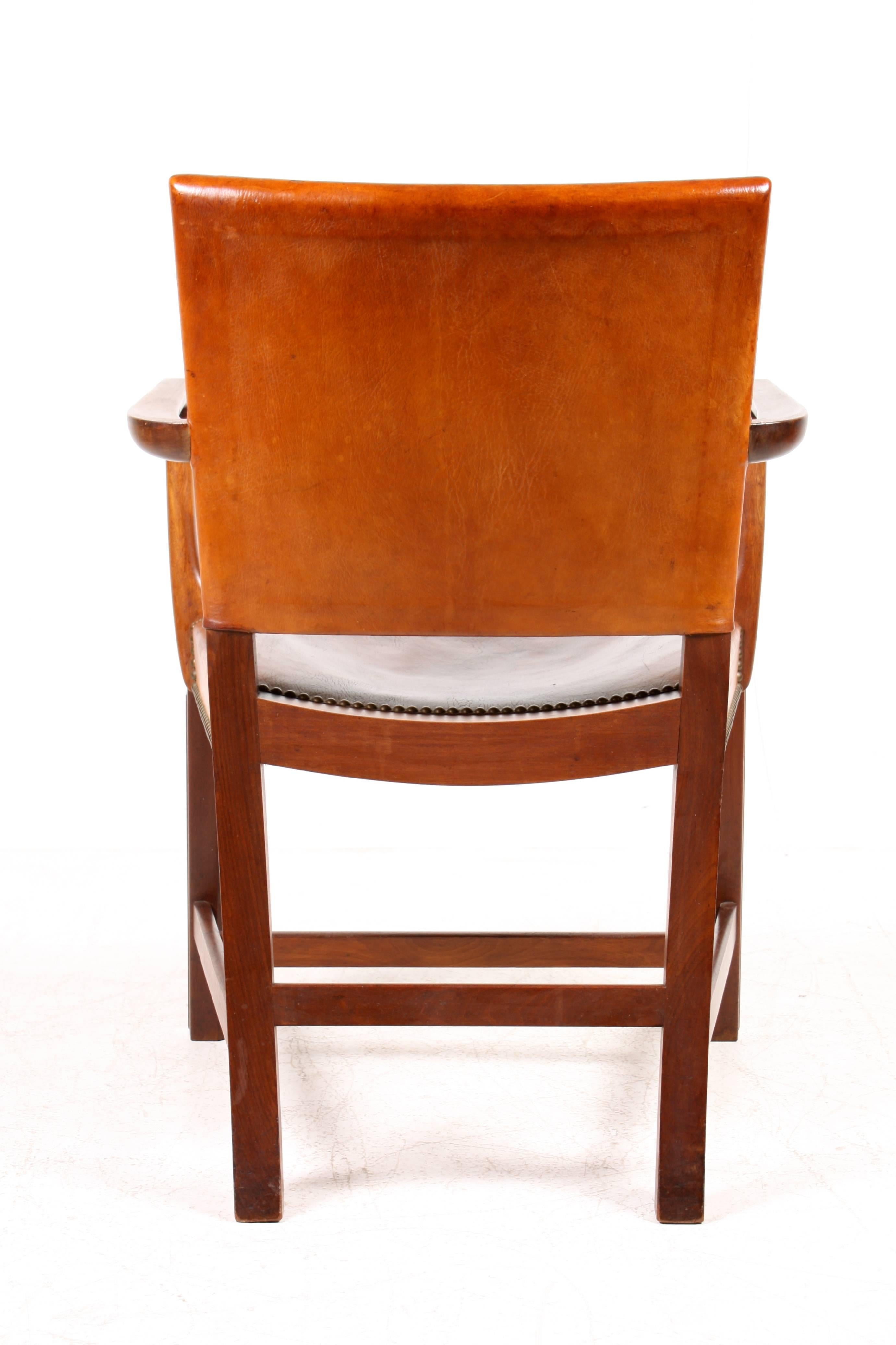 Red Chair by Kaare Klint in Cuban Mahogany and patnated Niger leather. Designed by Kaare Klint, Made by Rud Rasmussen Denmark. Original condition.