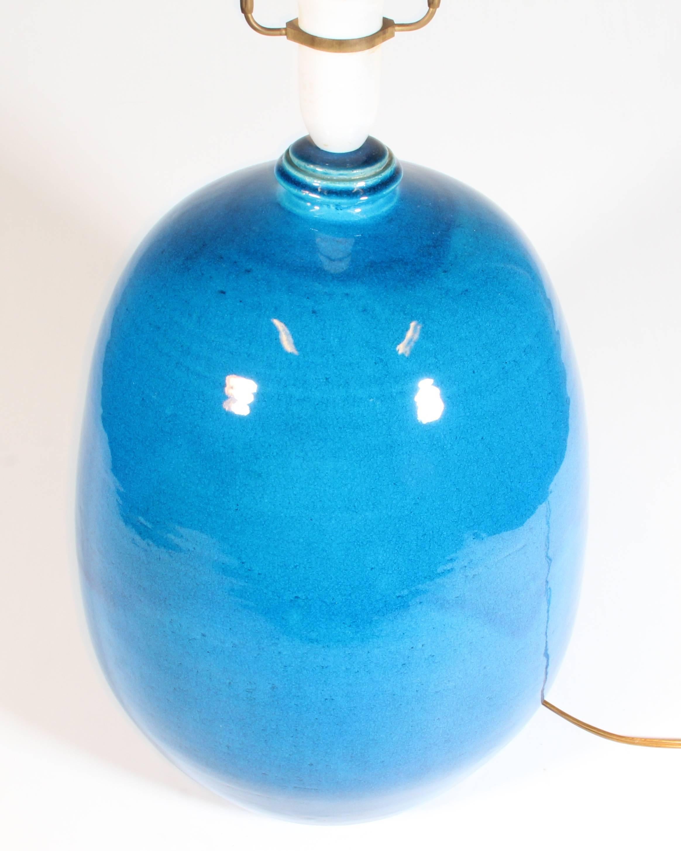 Blue table lamp in hand glazed ceramic by Kähler, Denmark. This piece is 41 cm without holder and 59 cm with.