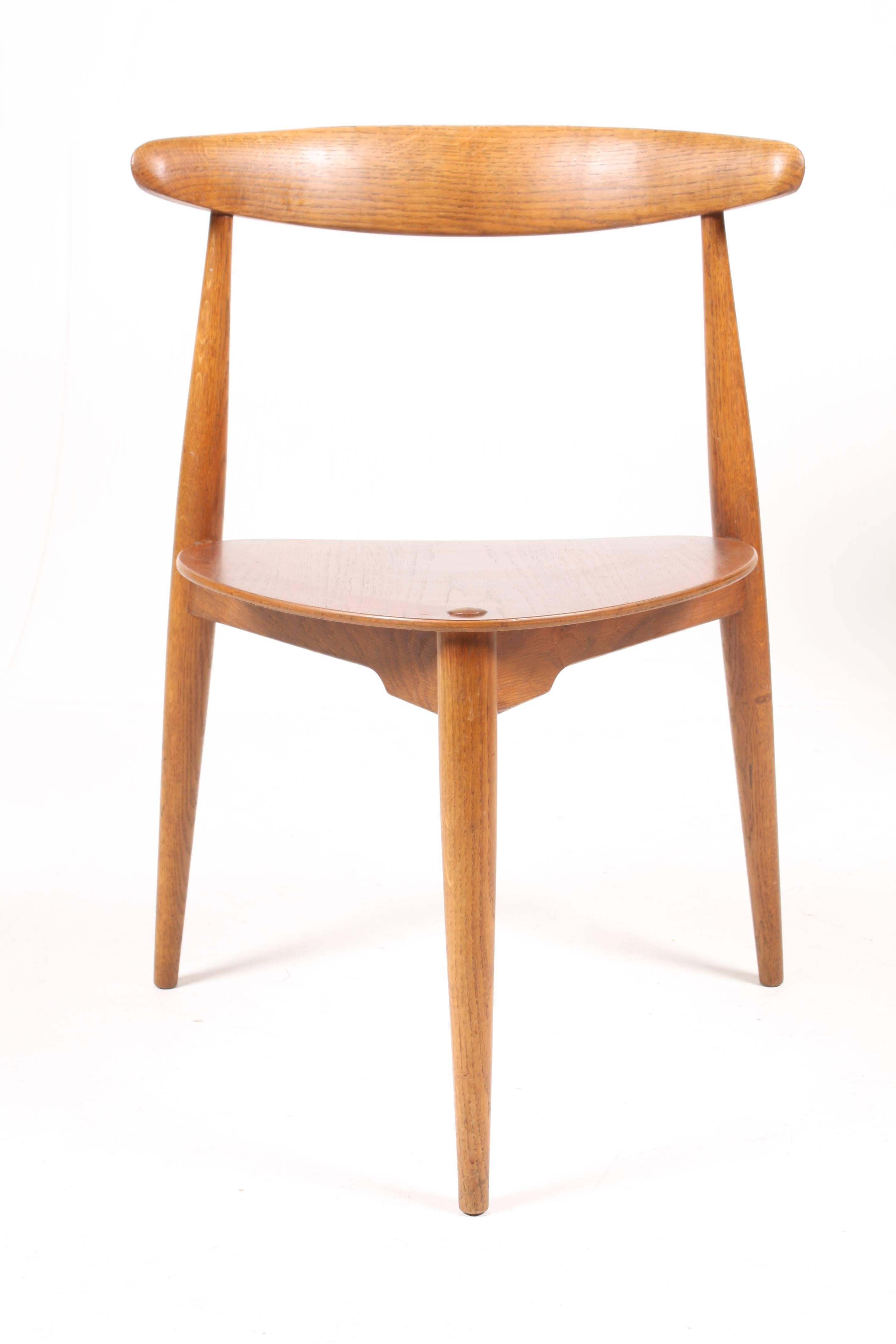 Set of six, 4103 chairs in teak and solid oak designed by Maa. Hans Wegner for Fritz Hansen Cabinetmakers in 1952. The chair also goes under the name 
