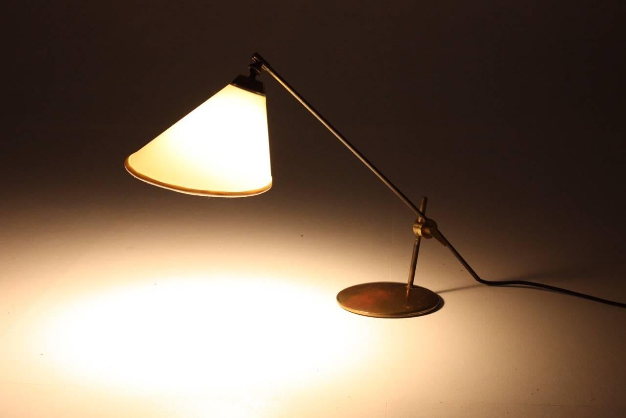 Great looking adjustable table lamp in brass. Designed and produced by Le Klint in the 1960s.  Made in Denmark.