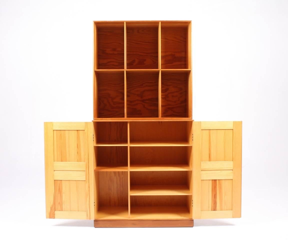 Bookcase and cabinet in patinated solid pine. Designed by Mogens Koch for Rud. Rasmussen cabinetmakers in 1933. Made in Denmark. Great original condition.
     