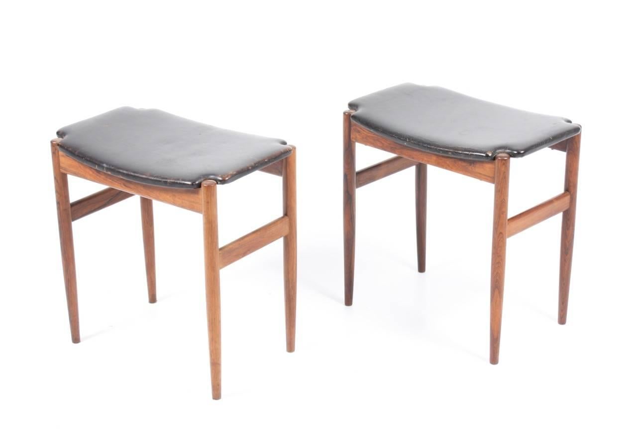 Pair of high quality rosewood stools. Seat in black well patinated leather. Designed and made by Danish cabinetmaker in Denmark, 1950s.
  