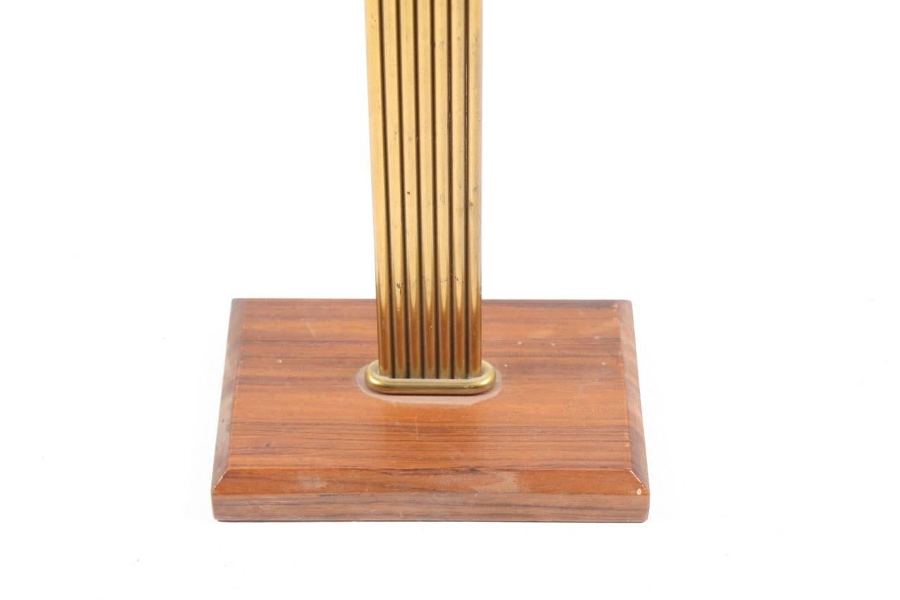 Rosewood and brass candlestick designed by in Denmark, 1950s.