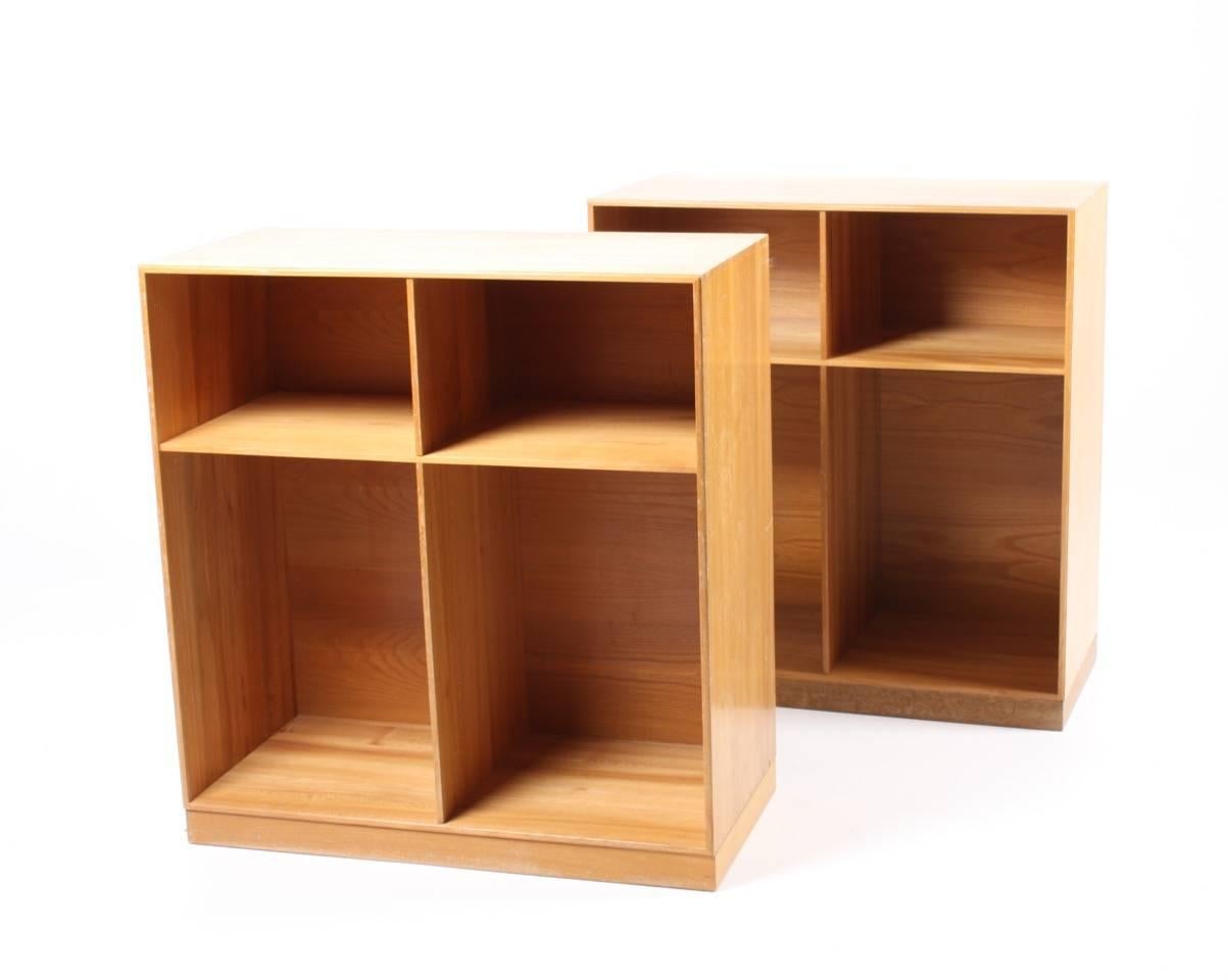 Pair of bookcases in solid elm. Designed by Mogens Koch for Rud. Rasmussen cabinetmakers in 1933. Made in Denmark and in all original condition.