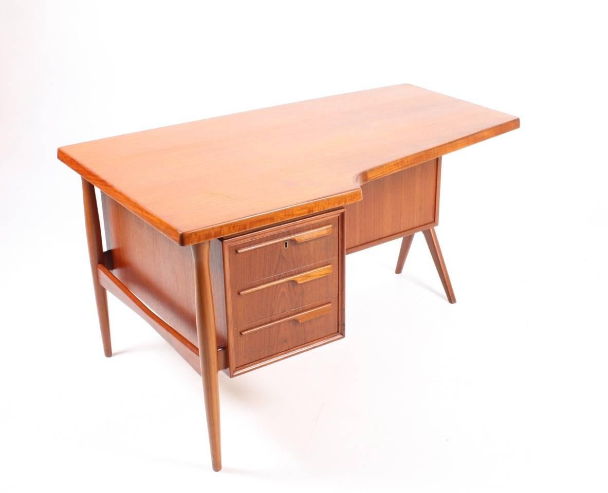 Freestanding desk in teak designed in the style of Peter Løvig / Arne Vodder . Great original condition, Denmark, 1960s.