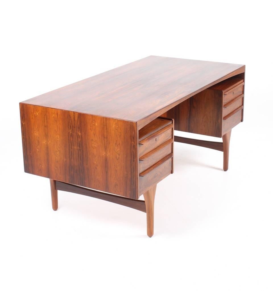 Freestanding rosewood desk in rosewood designed by Valdemar Mortensen and made in Denmark in the 1960s. Great condition.