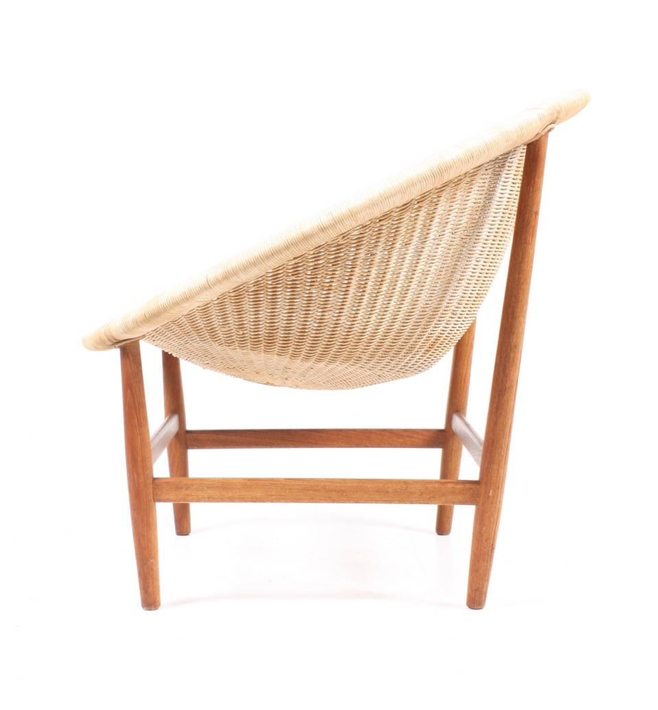 Lounge chair in cane and teak. Designed by Nanna and Jorgen Ditzel for Pontoppidan Cabinetmakers Copenhagen. Made in Denmark in the 1950s.