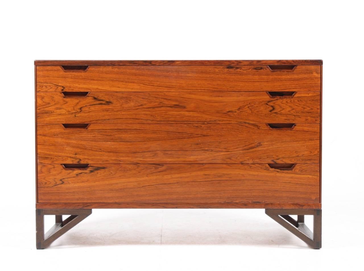 Elegant commode in rosewood designed by Svend Langkilde M.A.A. Made in Denmark, circa 1965. Great original condition.