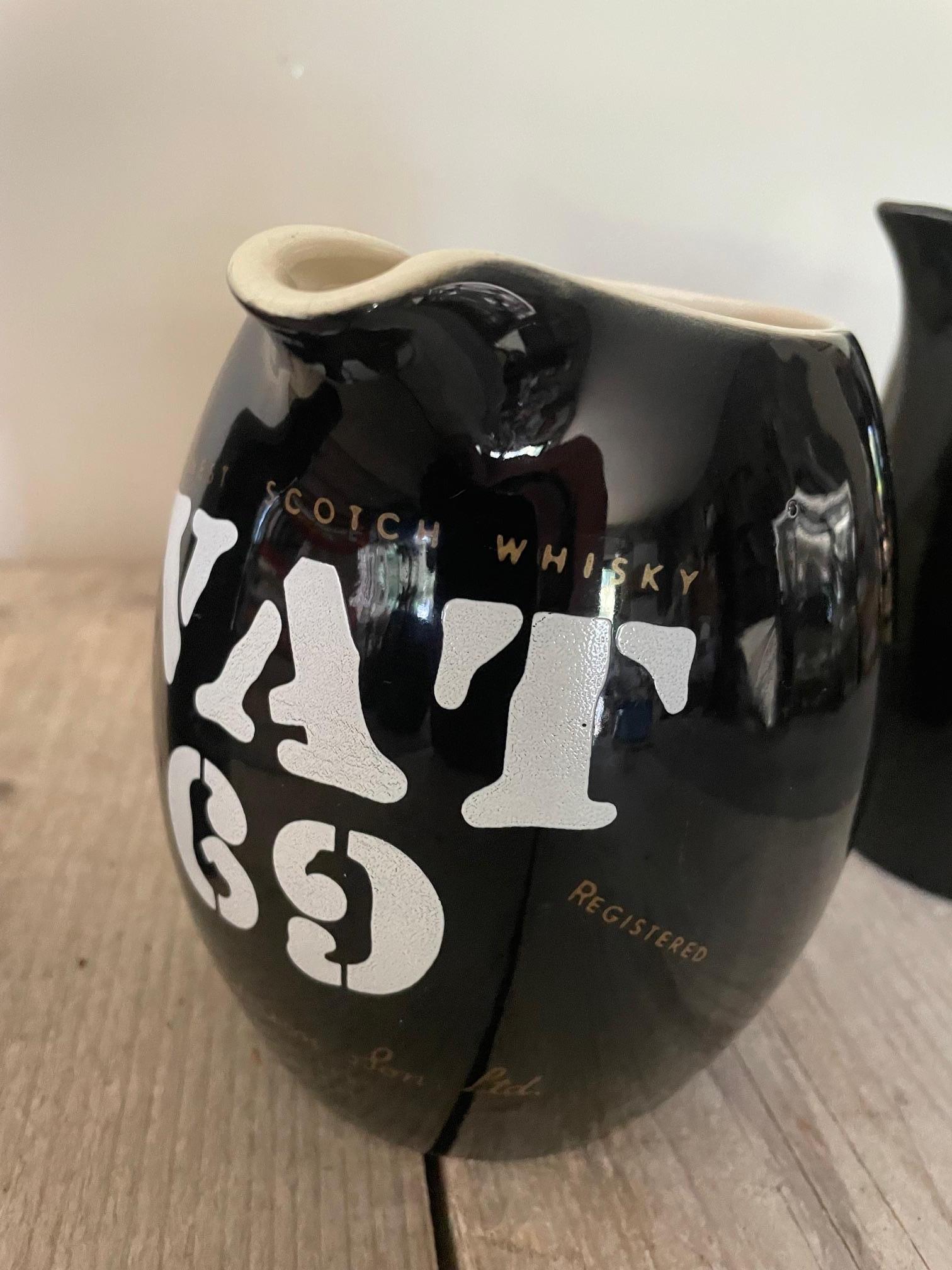 A Highland Queen, a Vat 69 and a Macleay Duff earthenware water jug, which was used for advertising in cafés in the 1950s.