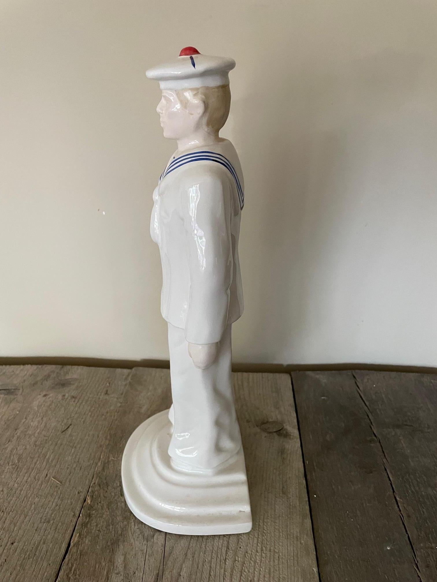 Statuette of a sailor in fine earthenware, 35cm high, moulded and hand-painted in the Art Deco style.