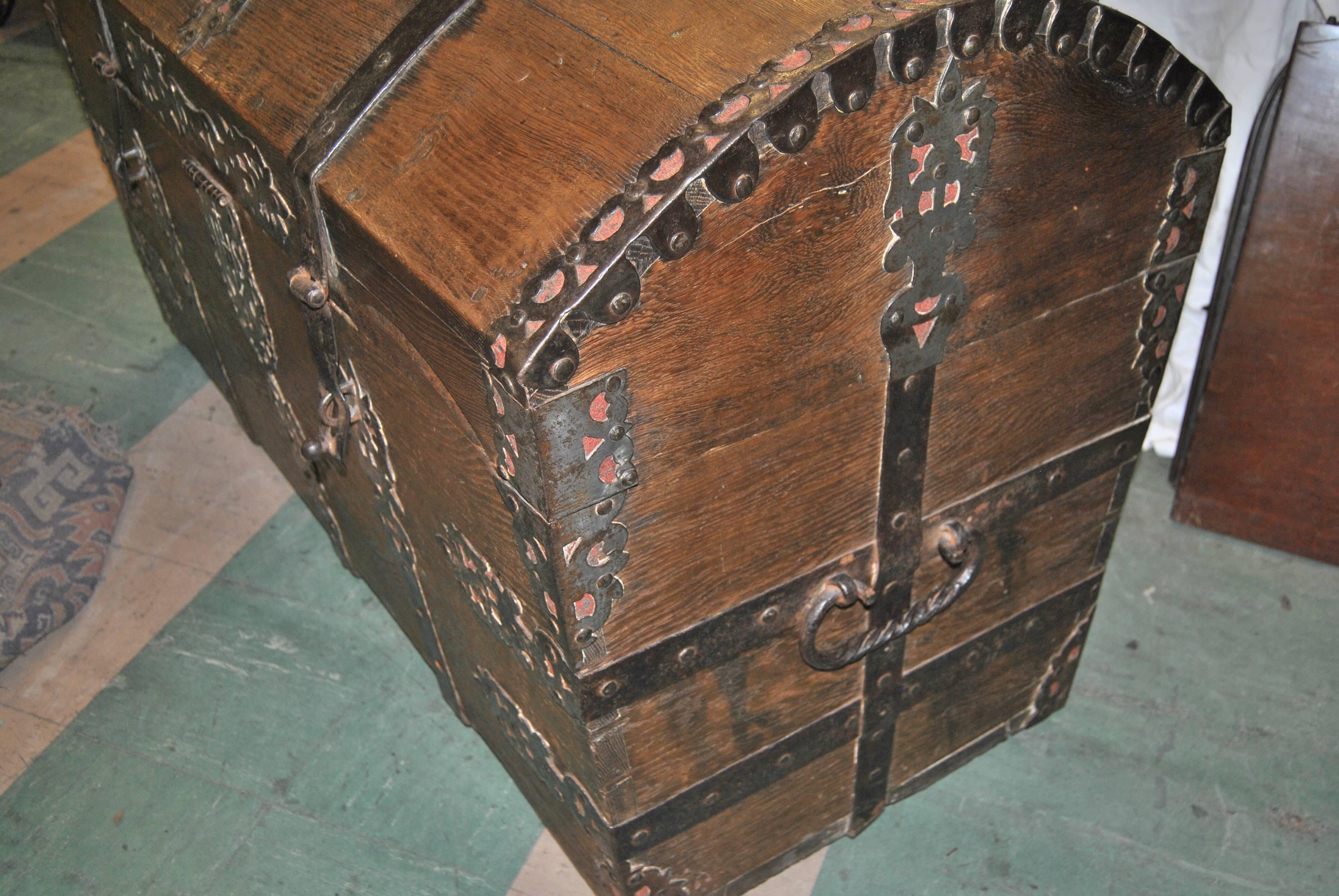 This is a Sea chest made in England, circa 1700. It is made of solid oak with hand-forged iron work throughout the entire chest. The beauty and quality of the iron work is amazing and as good as it can get. The chest is finished on the back so it is
