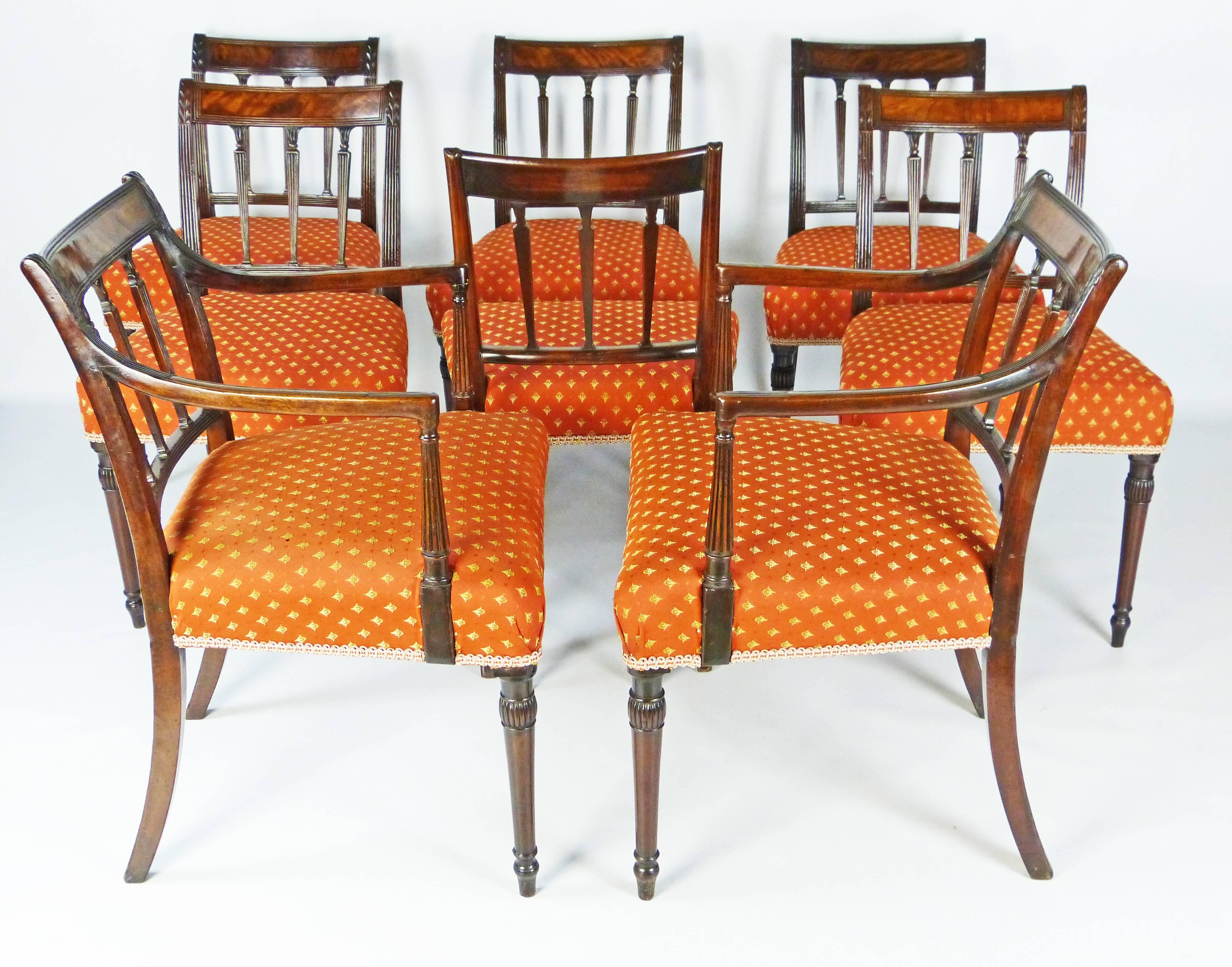 Outstanding set of 8 Cuban mahogany dining chairs from the George III period and of Sheraton design. The set is composed of six chairs and two armchairs of elegant lines all in exceptional original condition, possibly never having needed restoration