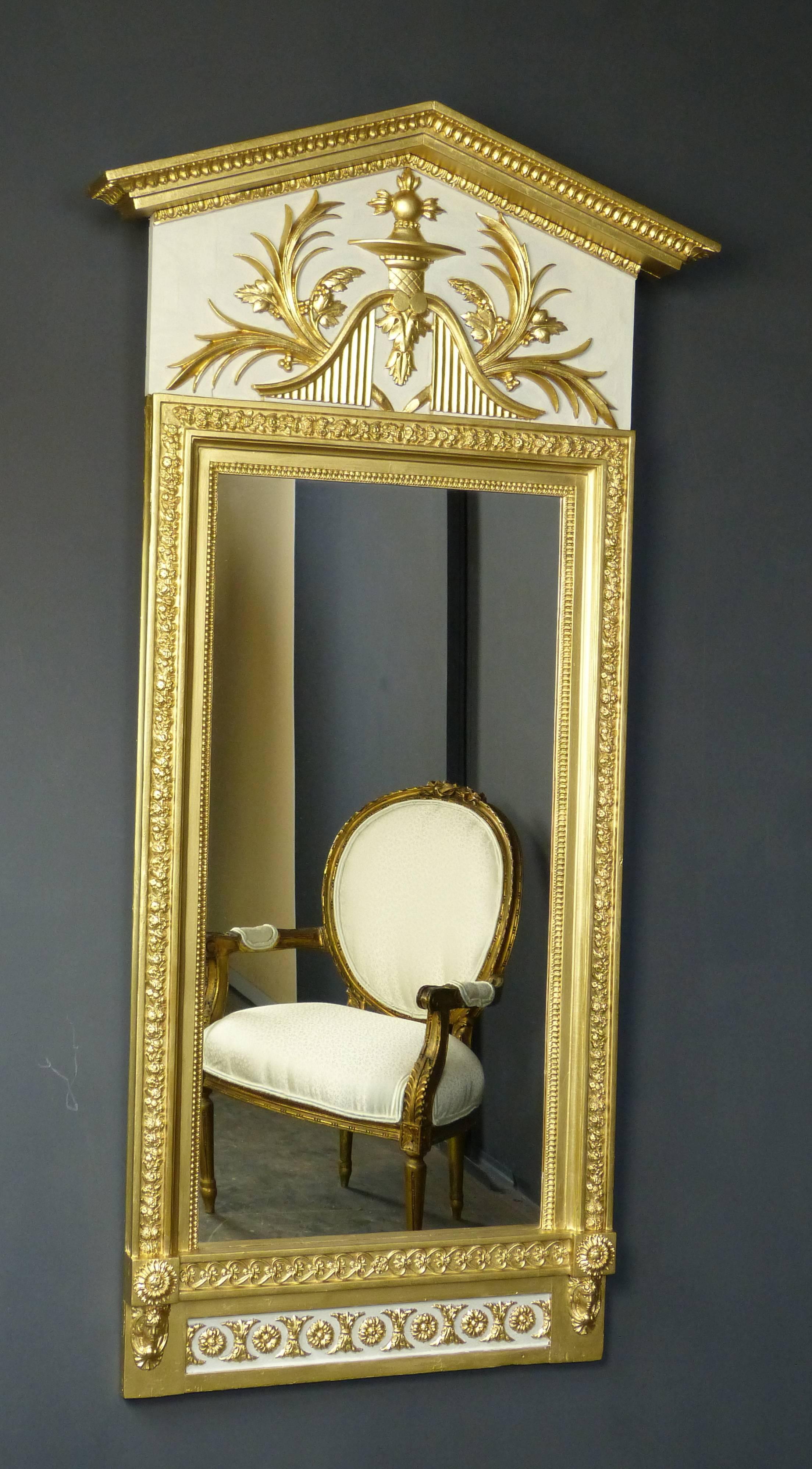 Fine early 19th century Gustavian mirror of architectural form, bearing label verso 'Jon Frisks', Swedish master mirror maker, parcel-gilt and painted over various carved wood designs of the Empire period during its transition to Biedermeier.

Jonas
