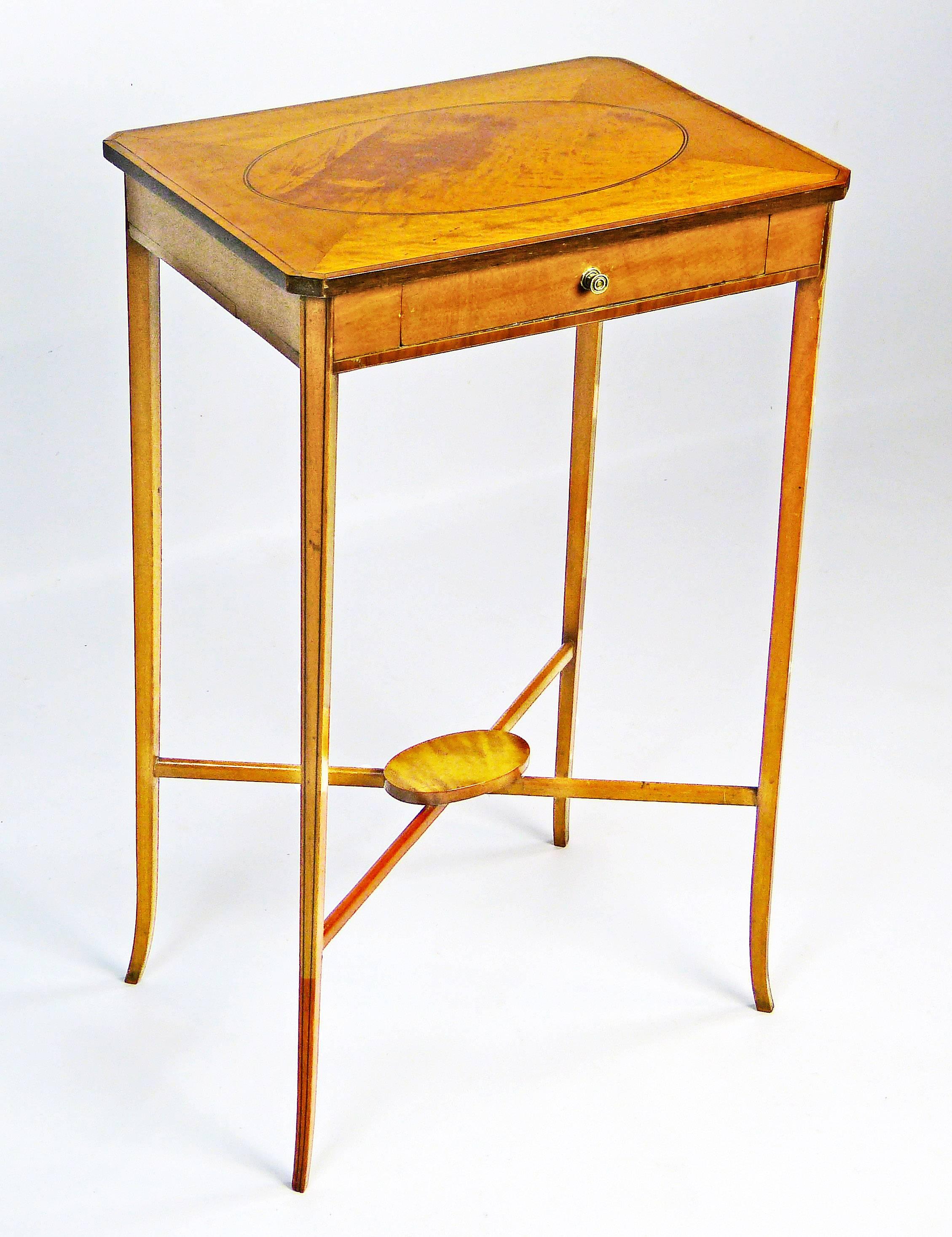 Petite side table Biedermeier of great proportions with four fine tapering and slightly outward curving birchwood legs, each with two ebony line inlays and united by X-shape stretchers with a centre oval lozenge of birch. The top with a satin birch