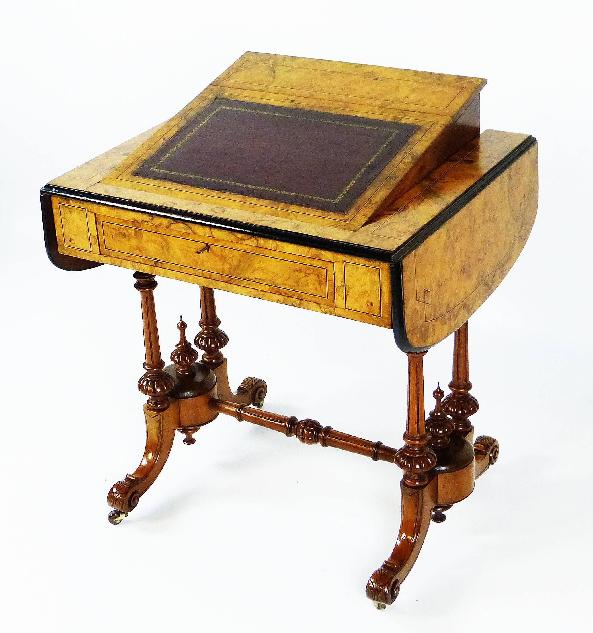 Fine quality small desk of the Victorian era with rising leather lined lectern centre section with an impeccable Davenport type stationery compartment and two side leaves that stay horizontal by the use of two finely carved supports on each side.