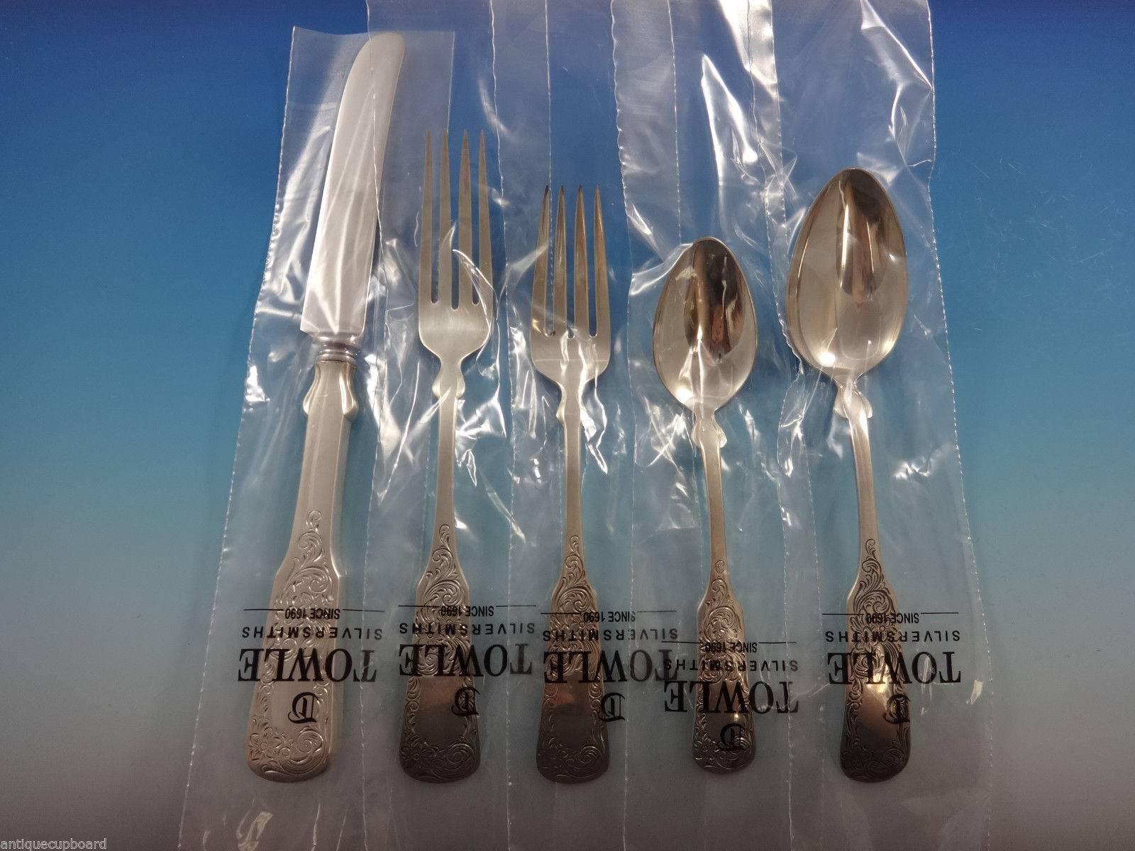 Beautiful Sixteen-Ni​Nety engraved by Towle sterling silver flatware set - 64 pieces. This set is still in the factory sleeves and includes:

12 place knives, 9 1/2