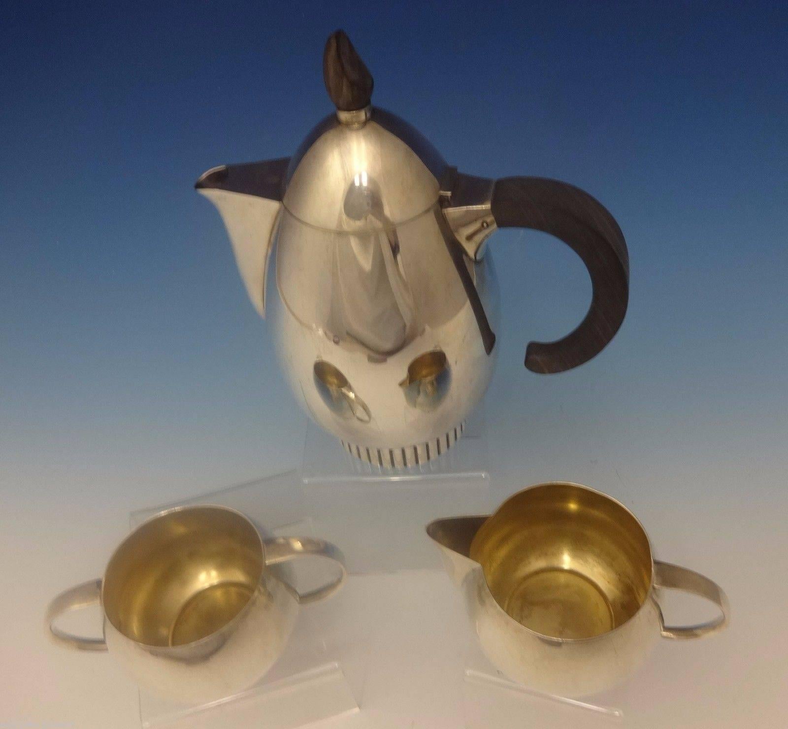 Classic beauty by Frank Smith.

Beautiful classic beauty by Frank Smith sterling silver three-piece tea set. It is marked #725. The set includes: 

Coffee pot: Has an ebony wood handle and measures 8 3/4