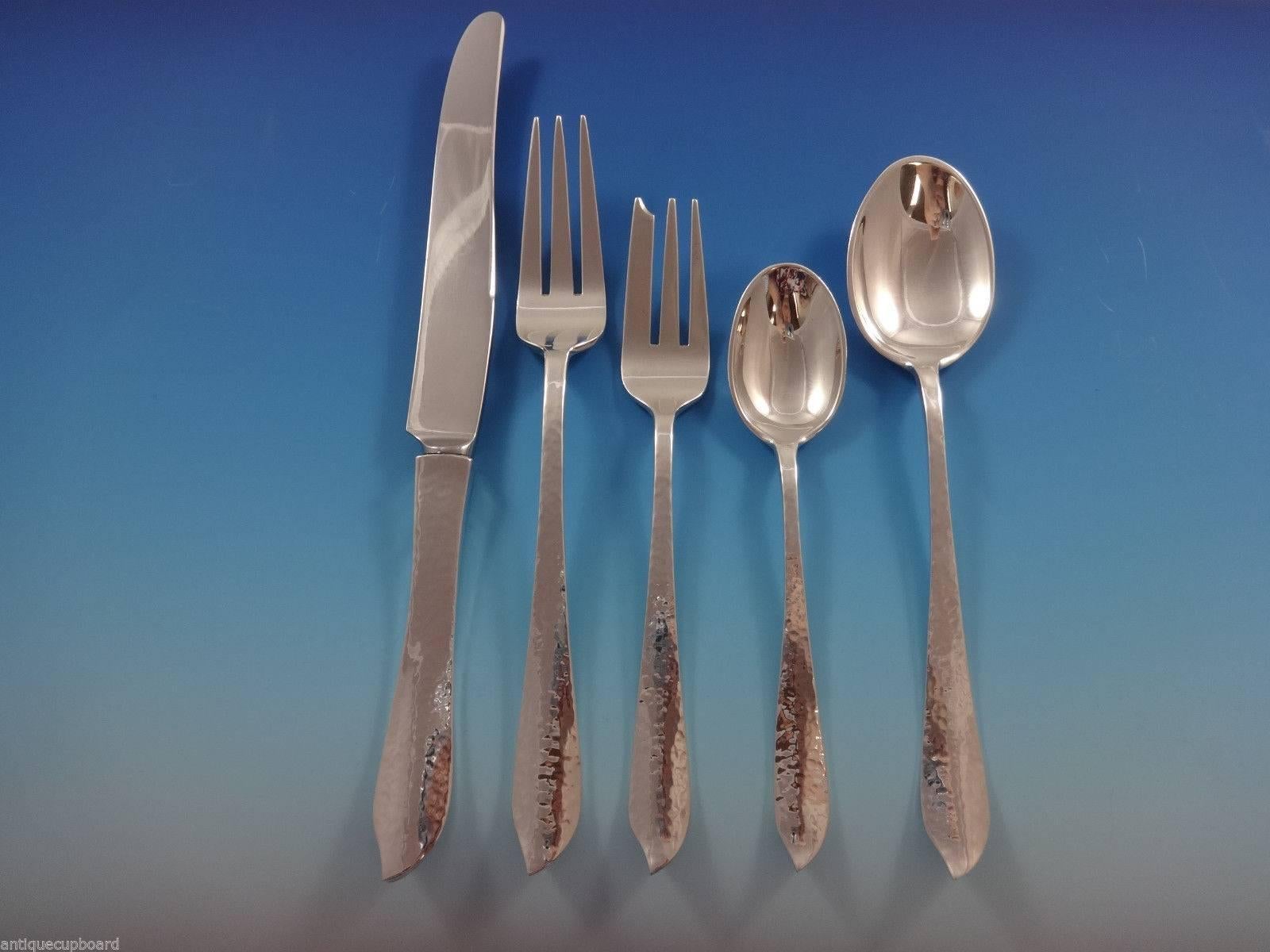 Old Newbury Crafters silver is genuinely handmade. The machine cannot match the quality, durability, look and feel of handmade silver. The hammered finish shows silver at its finest. 

 Exceptional IVY by Old Newbury Crafters sterling silver dinner