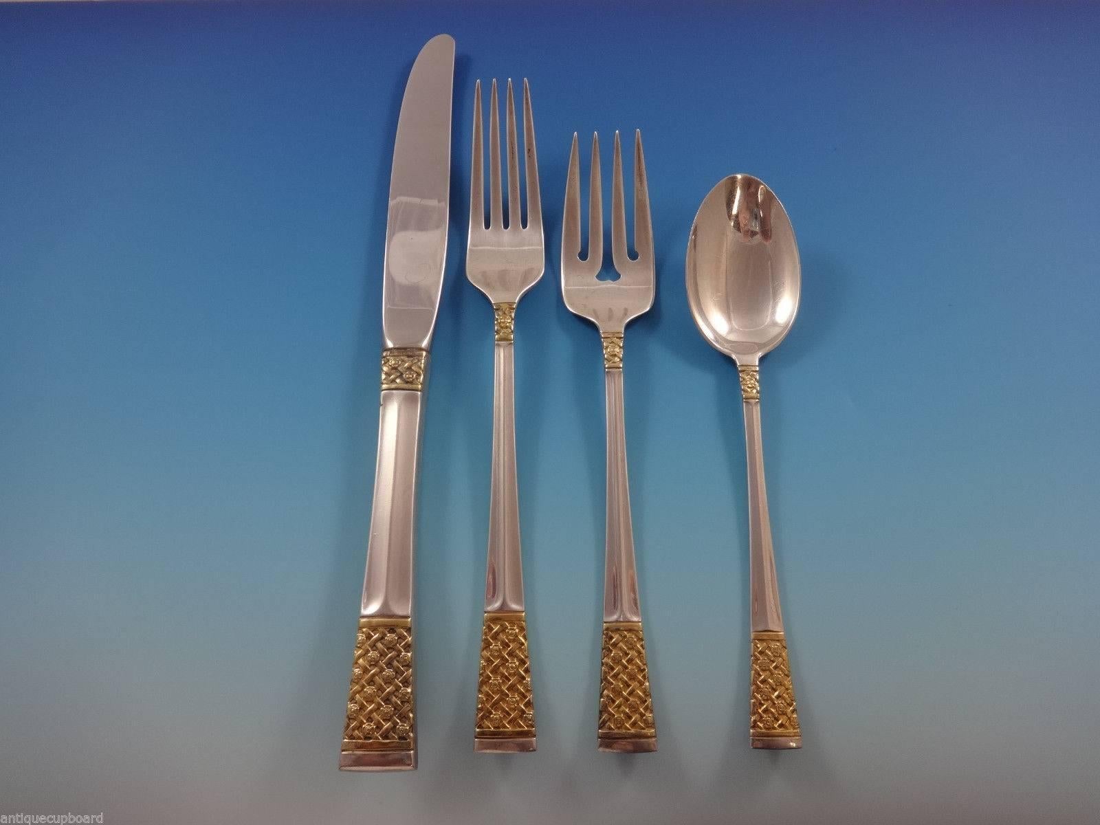 Golden Columbine by Lunt sterling silver with gold accent Flatware set of 32 Pieces. This set includes:

Eight knives, 9