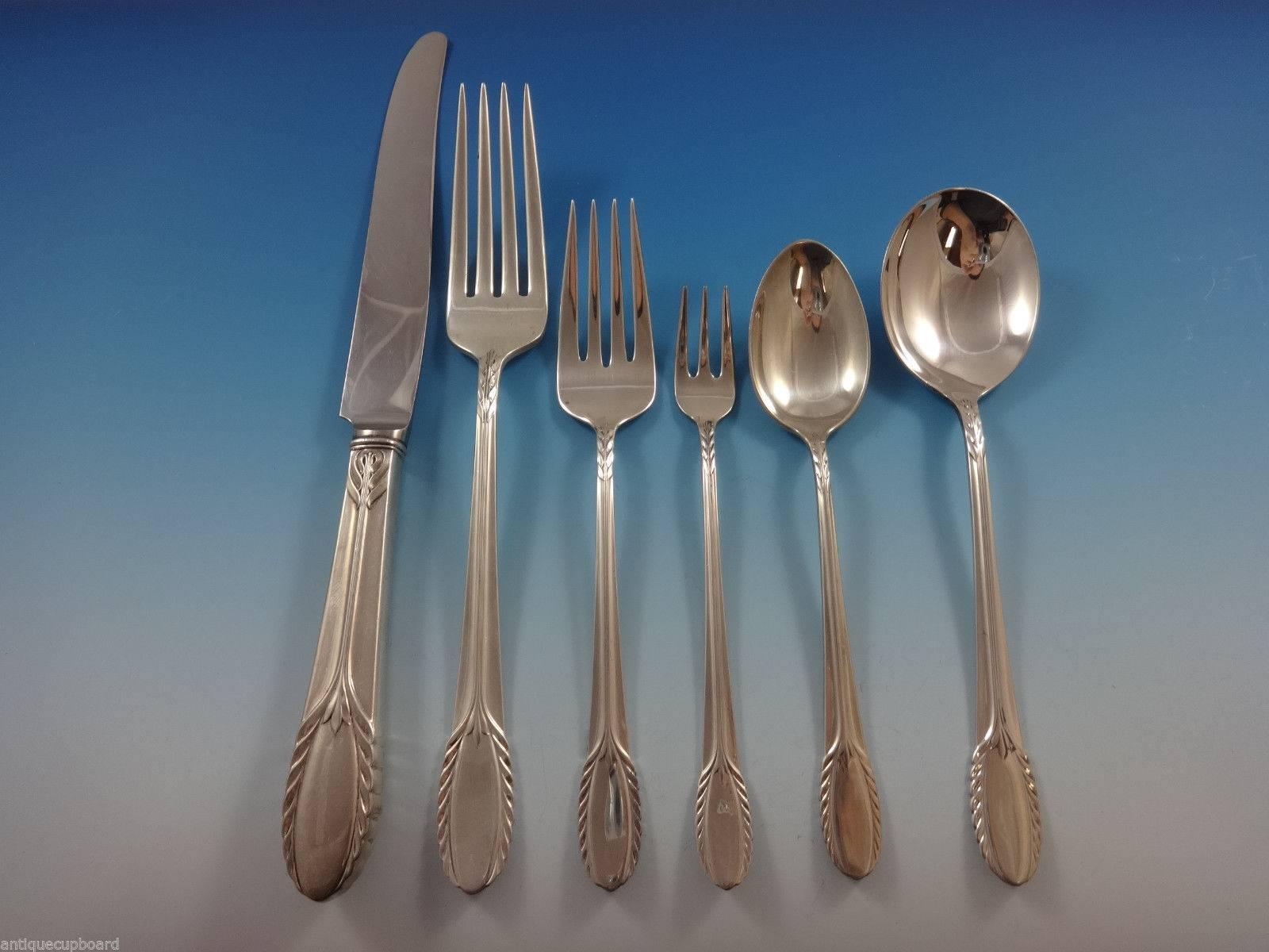 Lovely Trousseau by International sterling silver dinner size flatware set - 53 pieces. This set includes:

Eight dinner size knives, 9 5/8
