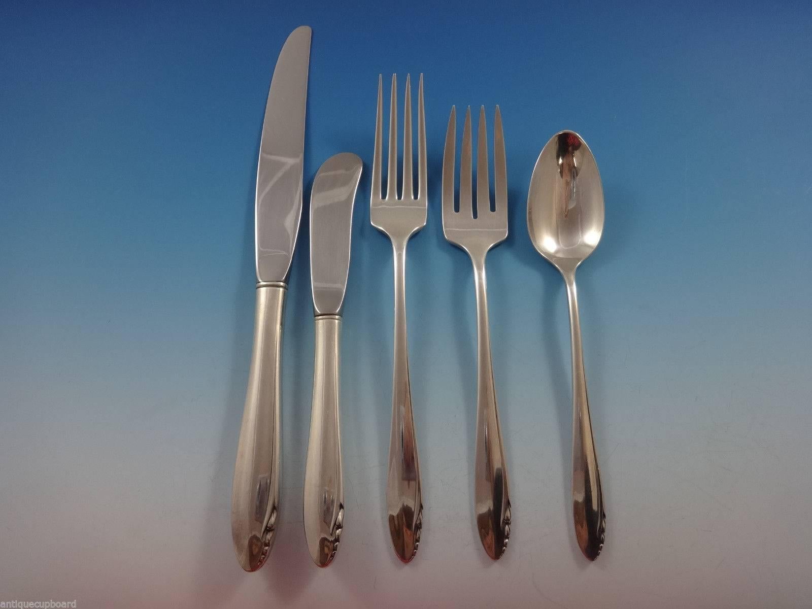 Lasting Spring by Oneida sterling silver flatware set of 63 pieces. This pattern has a simple, timeless, Mid-Century Modern design. This set includes:

12 knives, 8 7/8