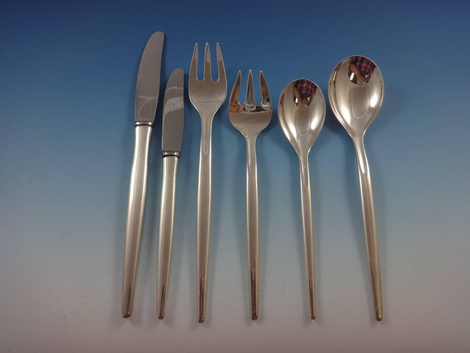 Danish Moderne sterling silver set in the pattern Tulip by A. Michelsen. Fine lines, top quality Danish sterling and heavy.
 
Tulip by A. Michelsen sterling flatware set. This set includes:

12 knives, 8 1/2