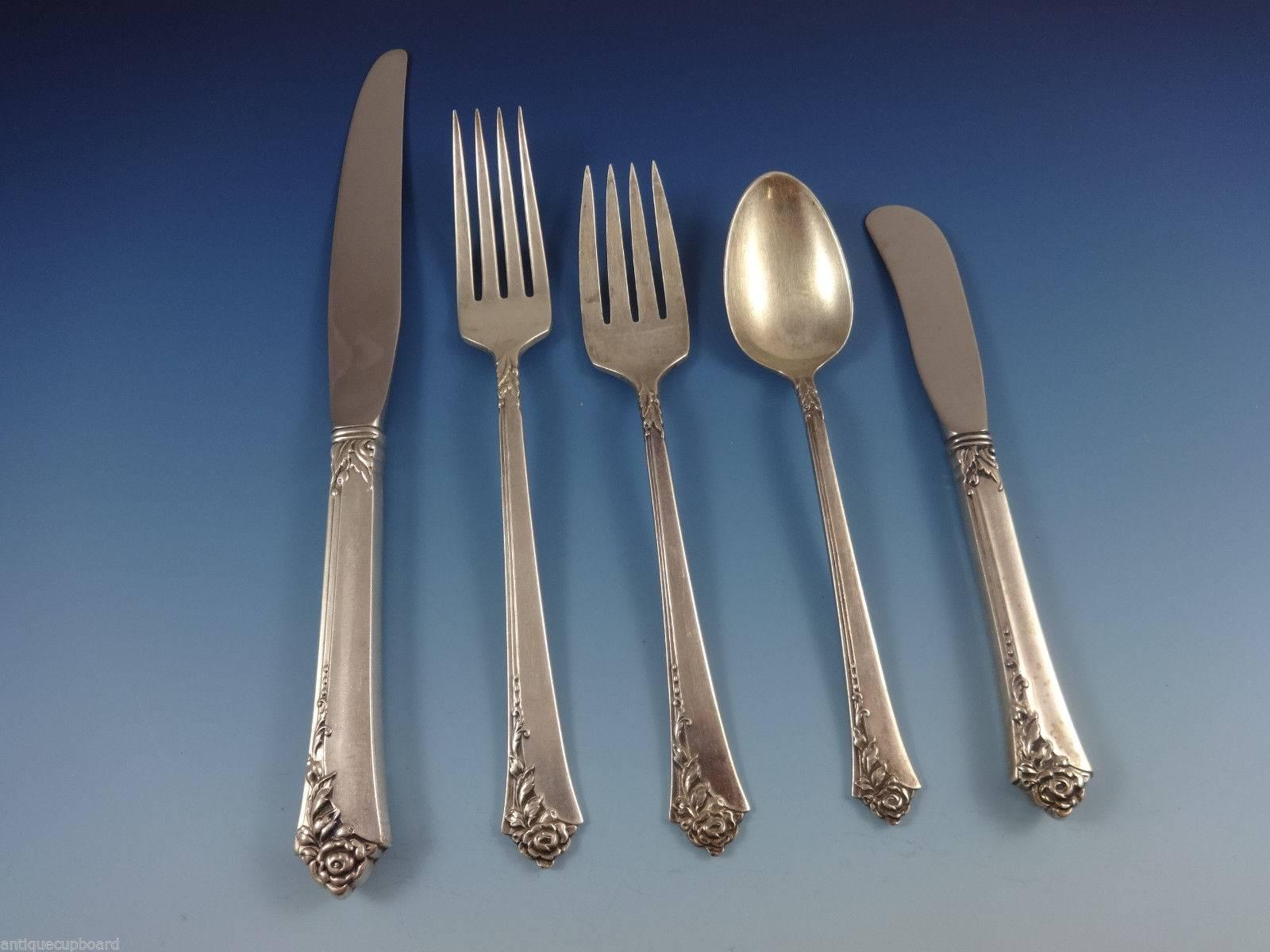 Damask Rose is a popular pattern that was released in the year 1946. The pattern has a three-dimensional rose motif with a modern twist.

Large Damask Rose by Oneida sterling silver flatware set of 69 piece set. This set includes:

12 knives, 8
