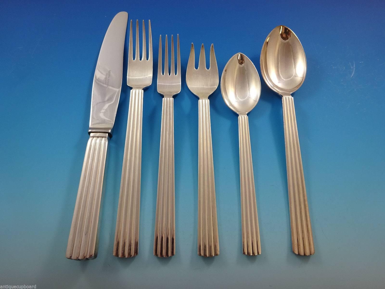 Eight dinner knives, 8 3/4".
Eight dinner forks, 7 5/8".
Eight salad forks, 4-tine, 7".
Eight teaspoons, 6 1/4".
Eight place soup spoons, 7 1/4".
Eight pastry/dessert forks, 3-tine, 6 3/4".
Two serving spoons, 8