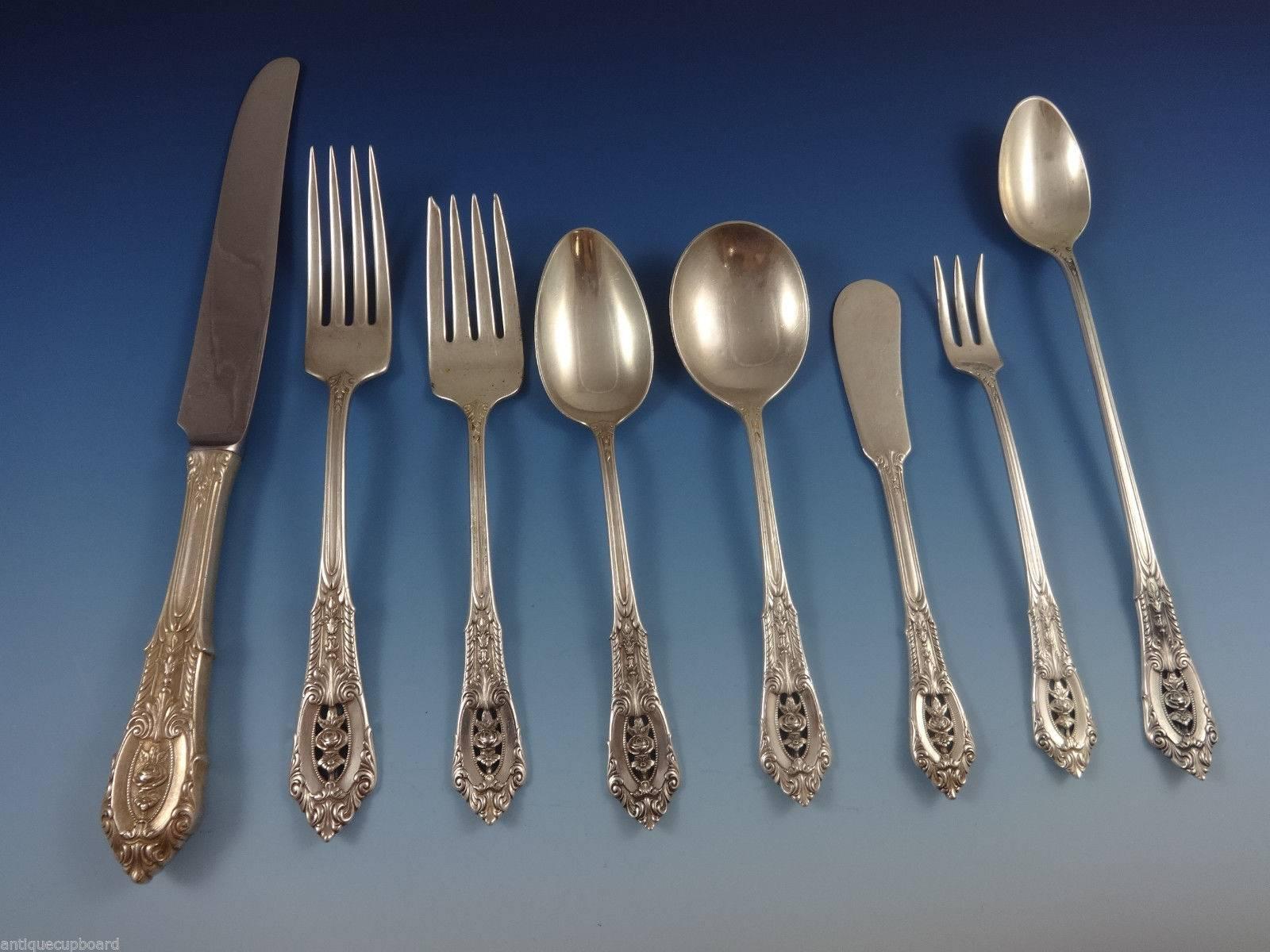 Intricate piercings and brilliant craftsmanship define this Rose Point sterling silver flatware, sure to become a treasured family heirloom. The design of silver lace and a floating rose amidst deep scrolls and shimmering dew drops will grace your