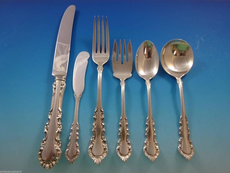 Georgian Rose by Reed & Barton sterling silver dinner size flatware set - 55 pieces. This set includes:

Eight dinner size knives, 9 5/8