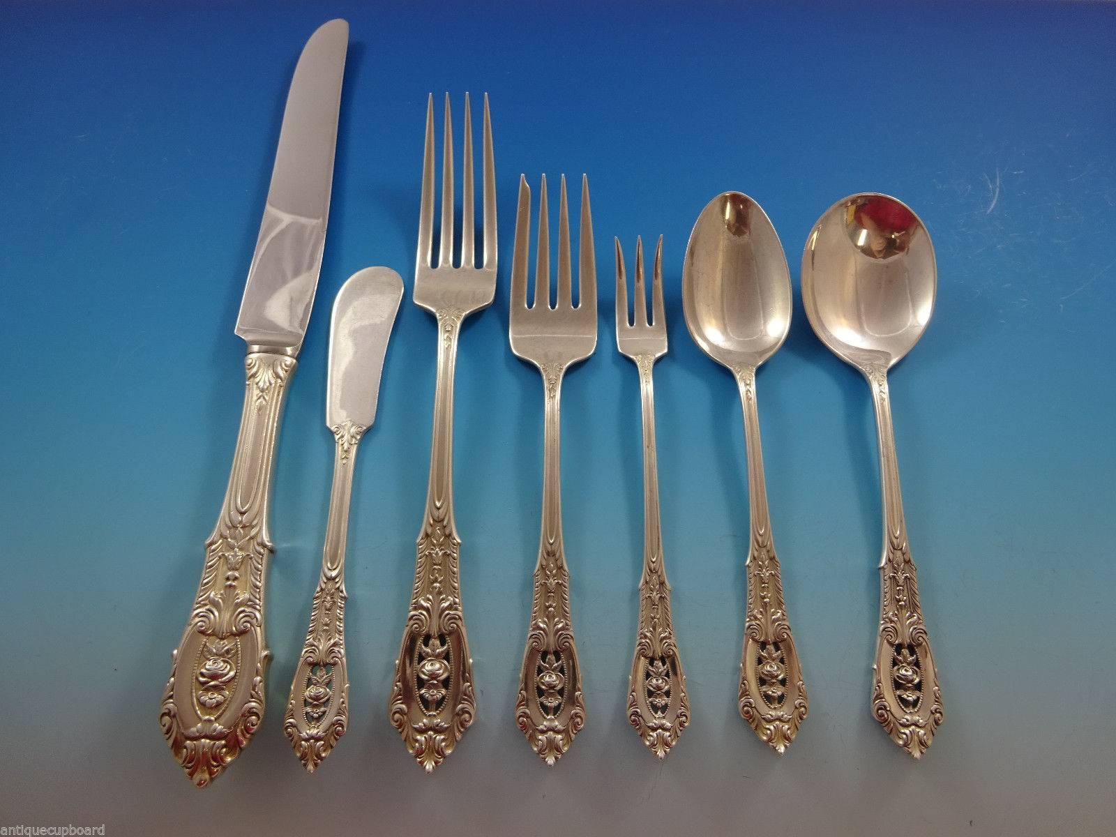 Intricate piercings and brilliant craftsmanship define this rose point sterling silver flatware, sure to become a treasured family heirloom. The design of silver lace and a floating rose amidst deep scrolls and shimmering dew drops will grace your